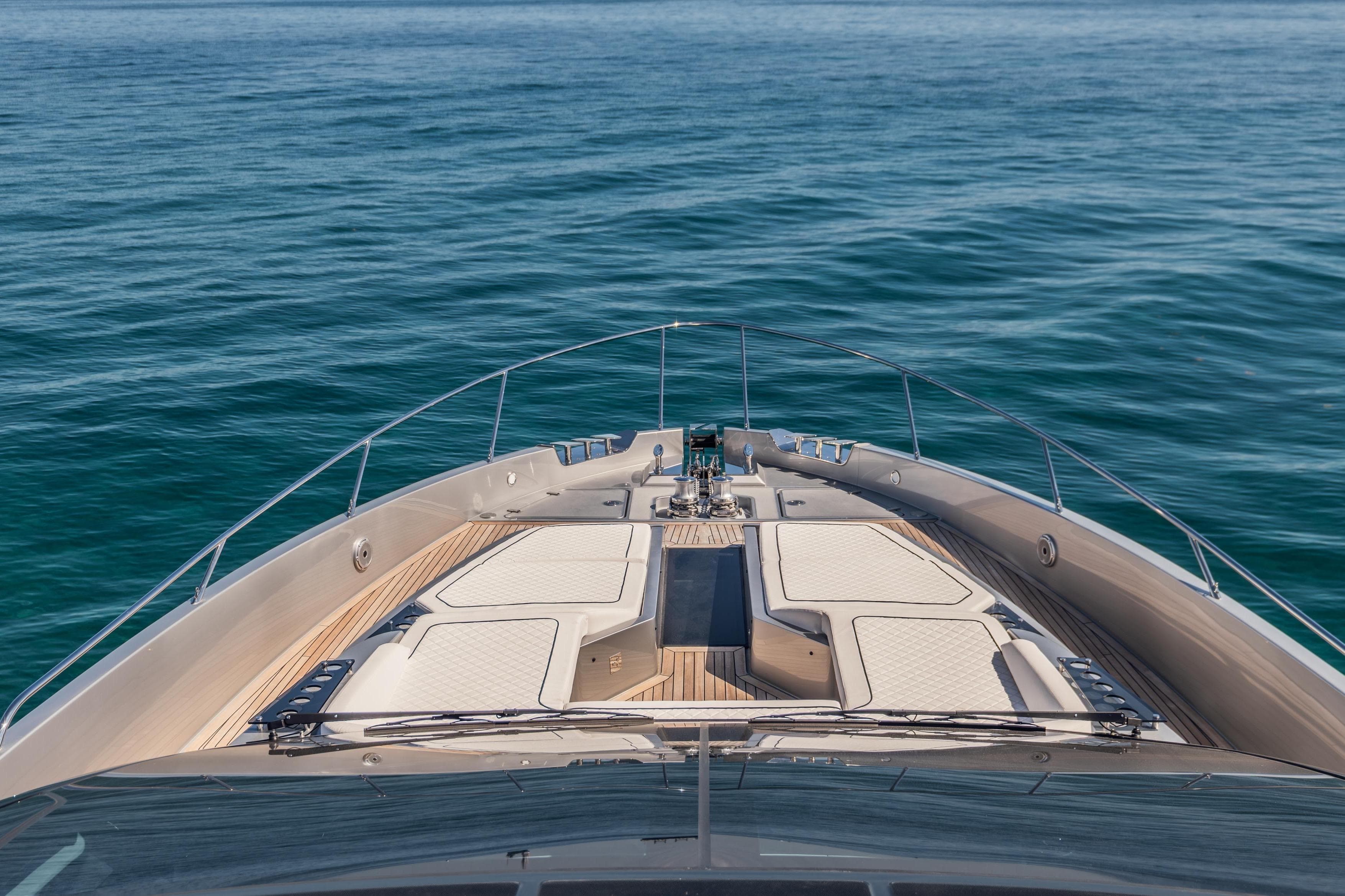 Luxurious 2026 Riva 82' Diva yacht cruising on serene blue waters.