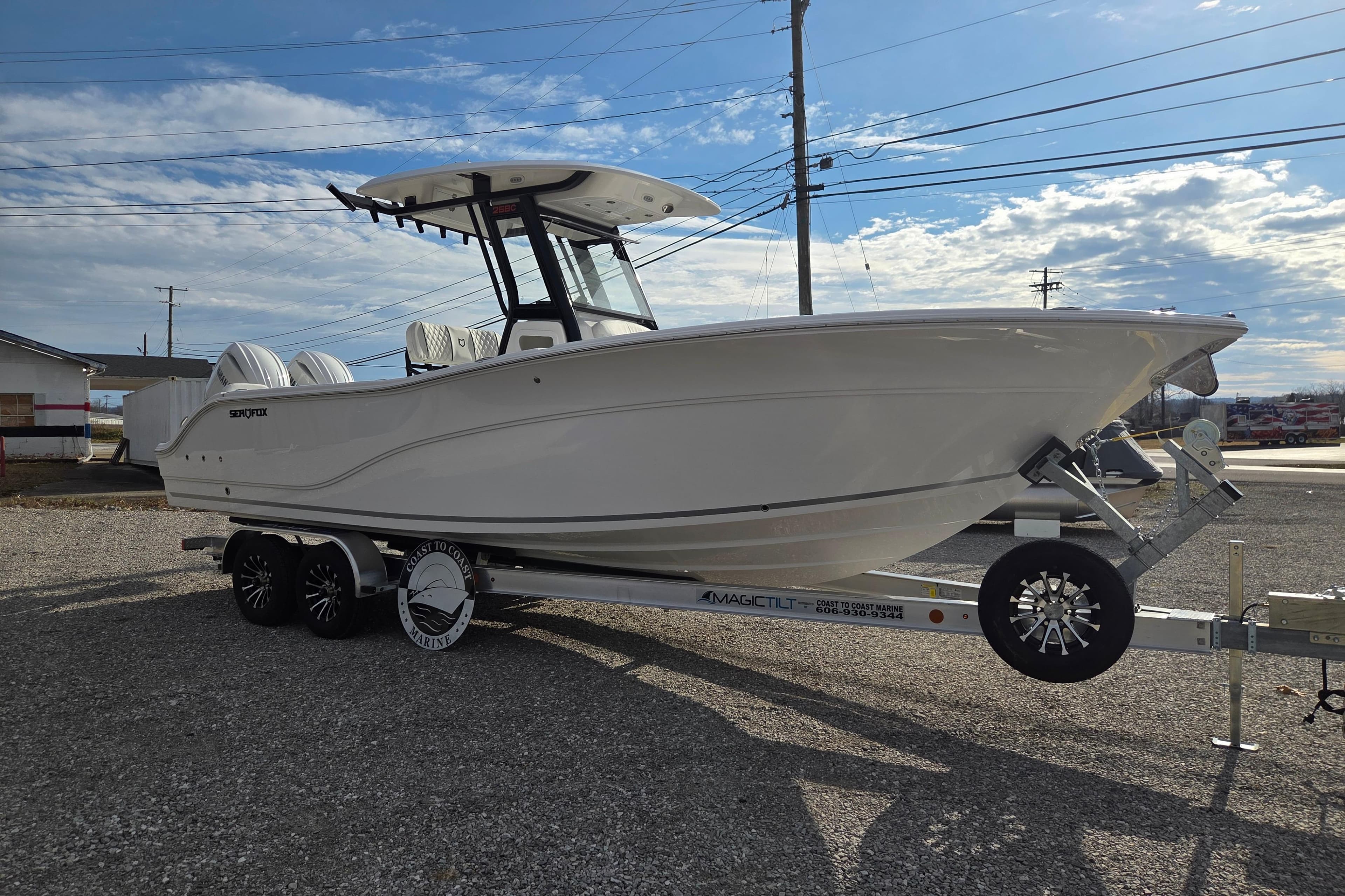 2026 Sea Fox 268 Commander boat on trailer under a clear sky.