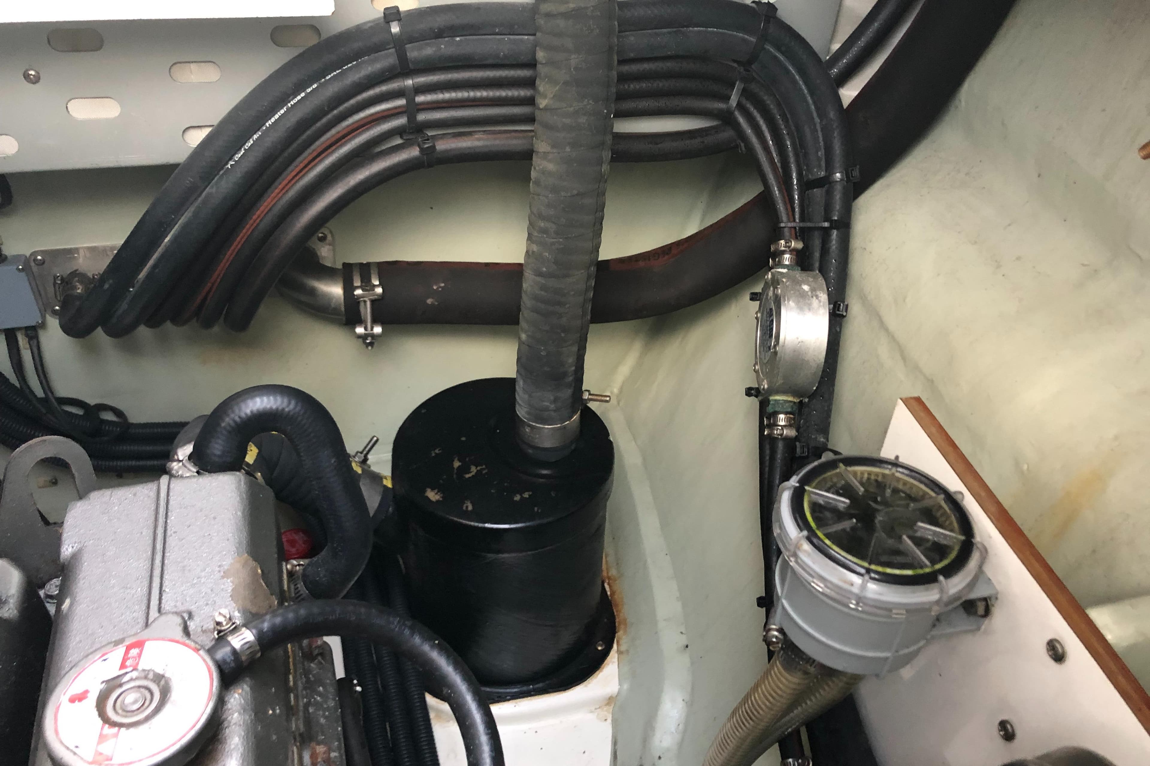 Engine compartment of a 2013 Leopard 39 Owner's Version yacht, showing hoses and components.