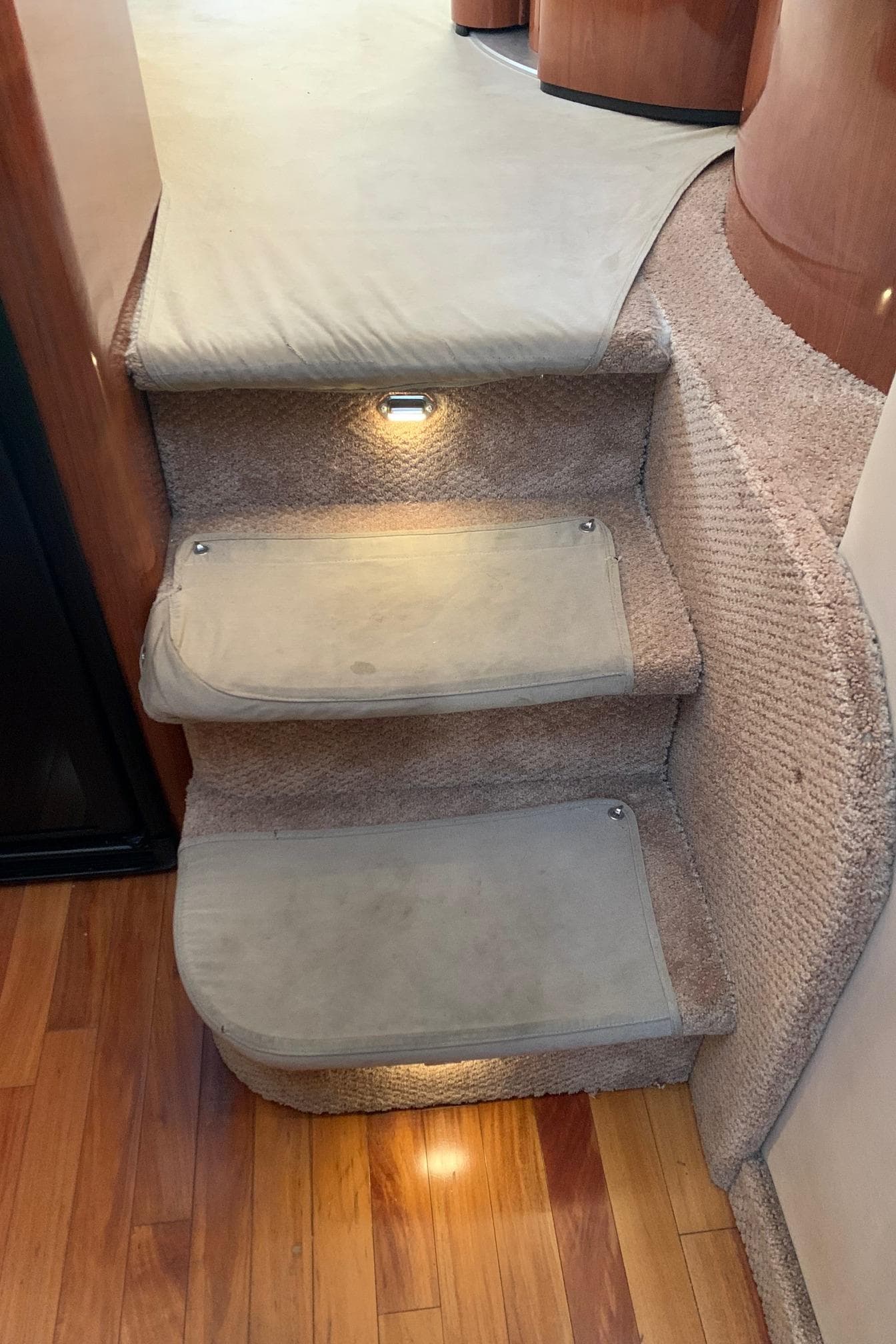 Carpeted steps in a 2004 Sea Ray 390 Motor Yacht.