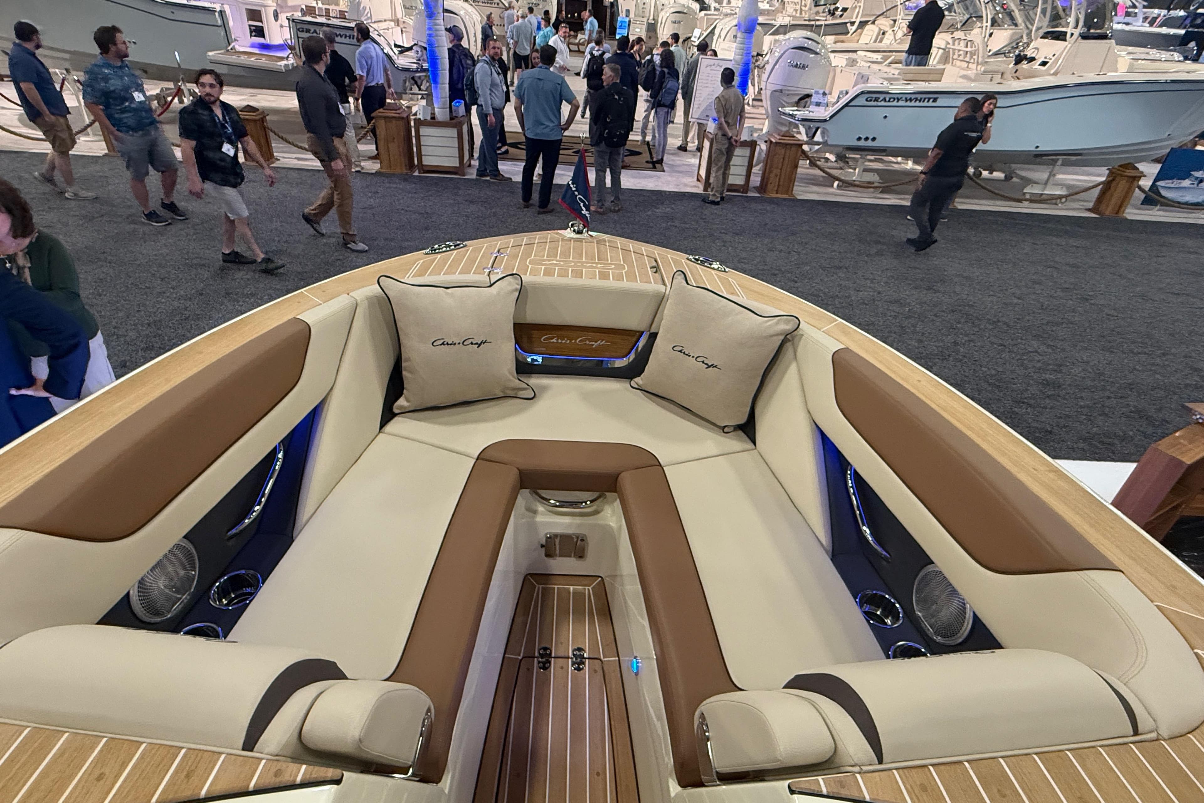 Luxurious interior of 2026 Chris-Craft Launch 27 boat at a boat show.