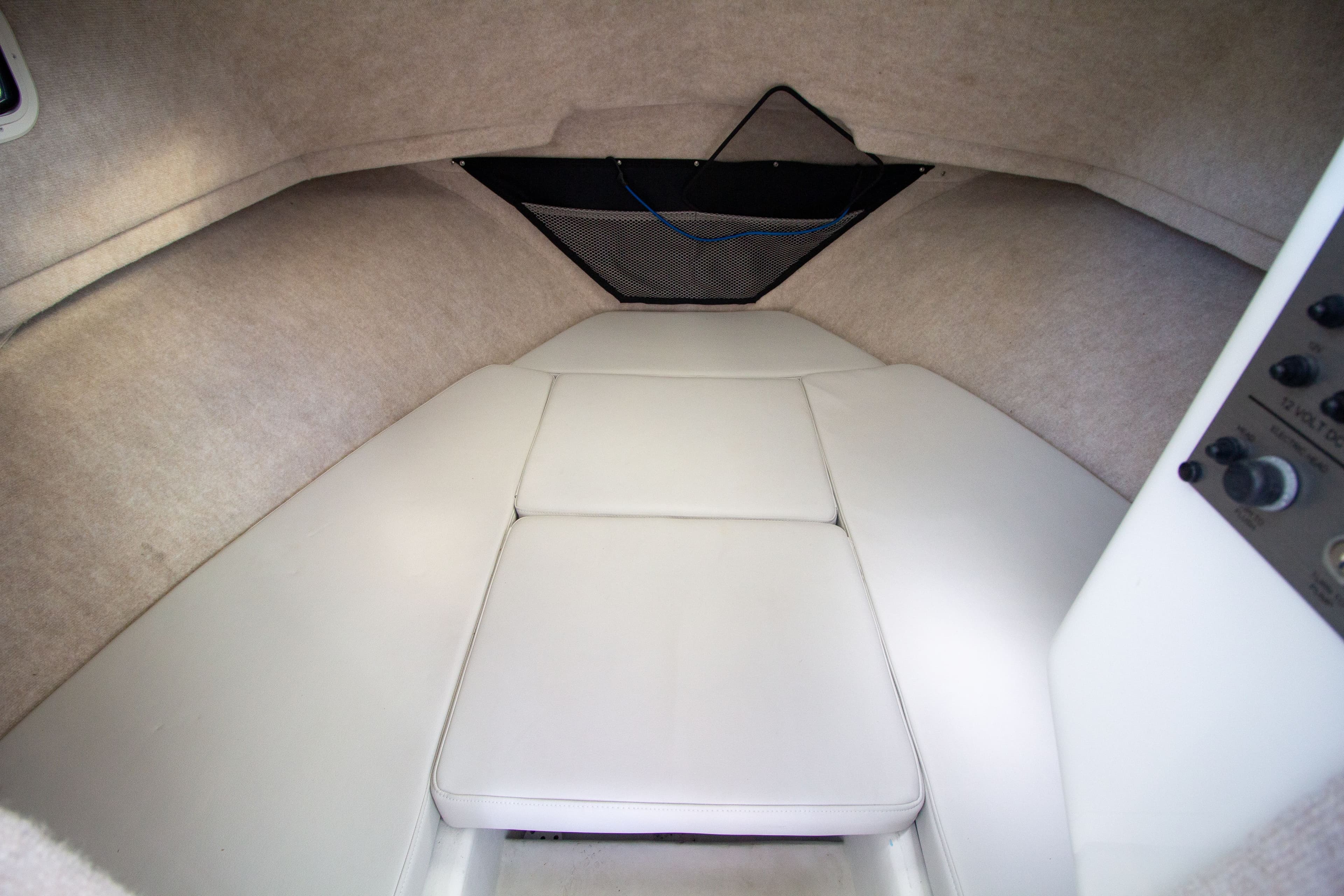 Interior of 2022 Parker 2520 XLD Sport Cabin with cushioned seating.
