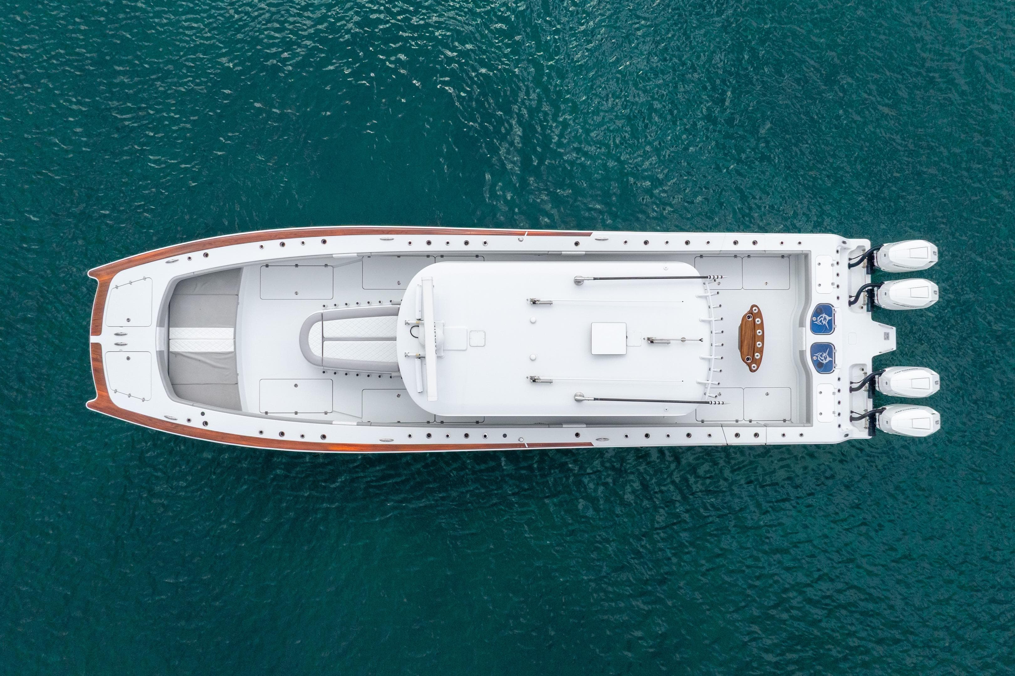 Aerial view of 2024 Freeman 47 boat on clear blue water.