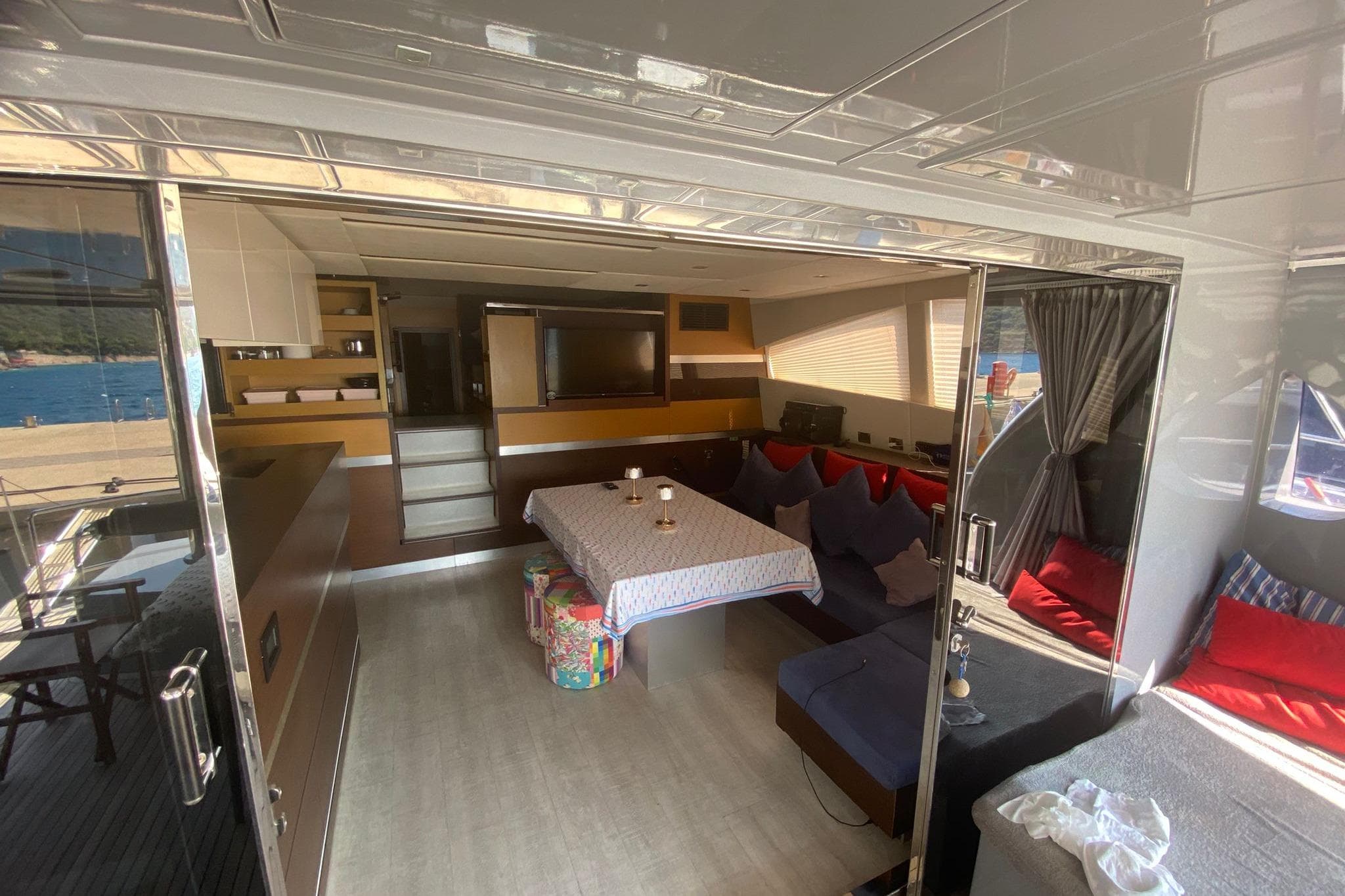 Luxurious interior of 2012 Sunreef 60 yacht with modern furnishings and scenic ocean view.