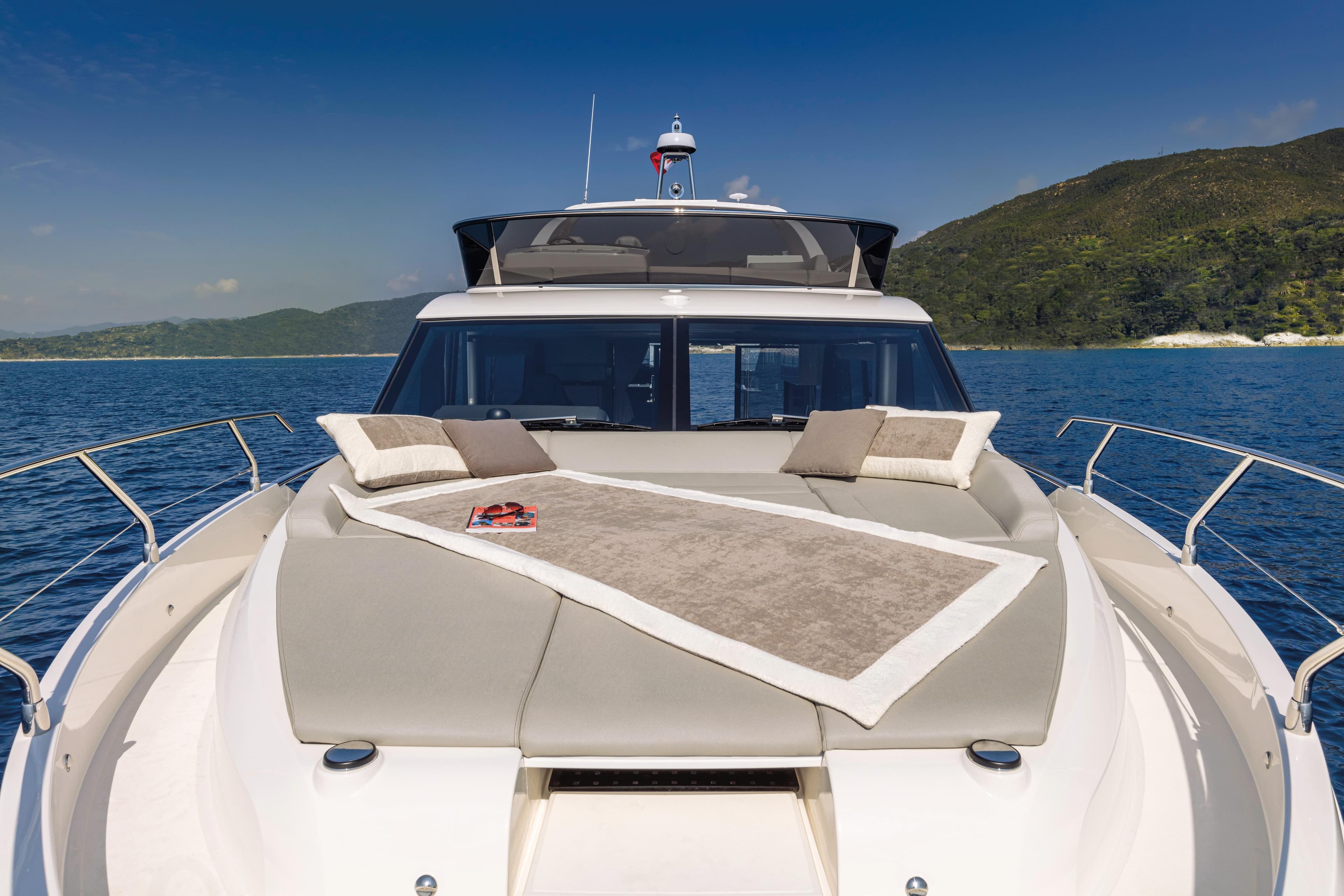Luxury Absolute 47 Fly yacht 2025 model on serene blue waters.