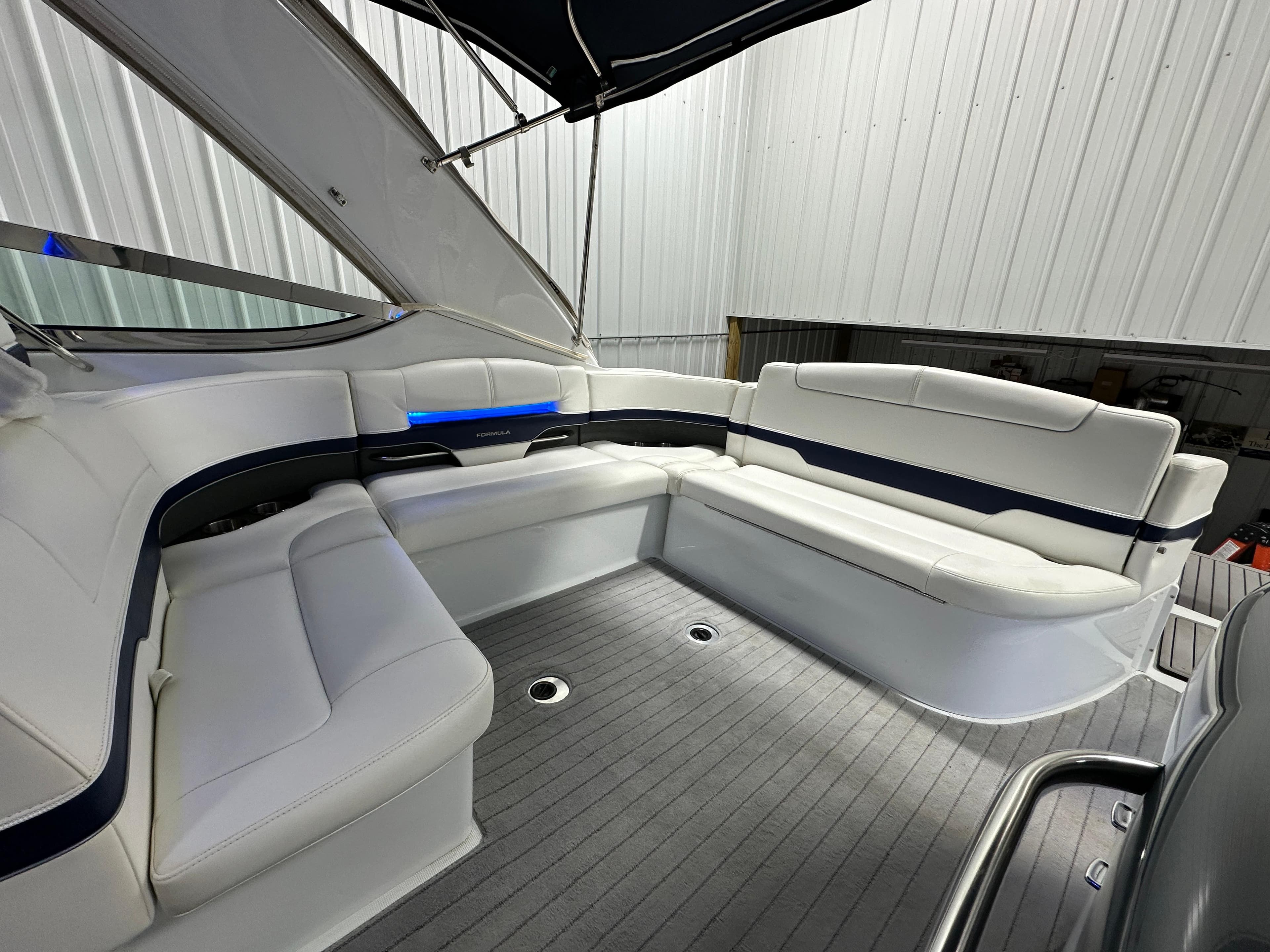 2014 Formula 370 Super Sport boat interior with white seating and sleek design.
