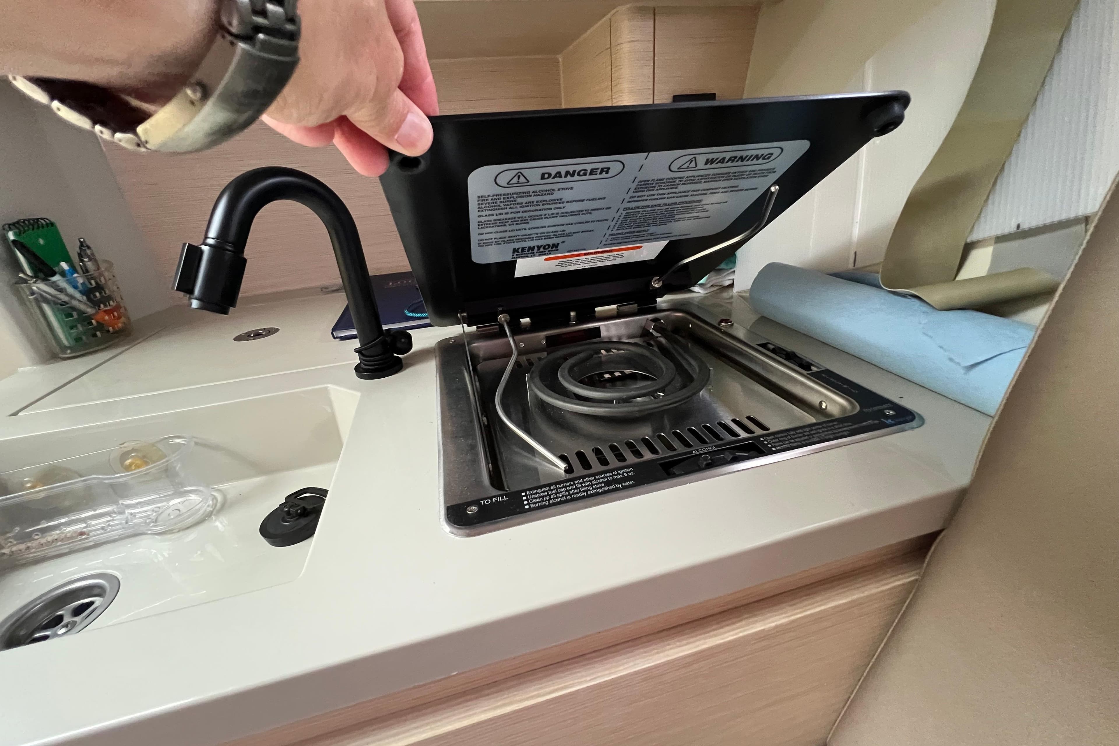 Compact kitchen area in 2022 Saffier 33 Life yacht with stove and sink.