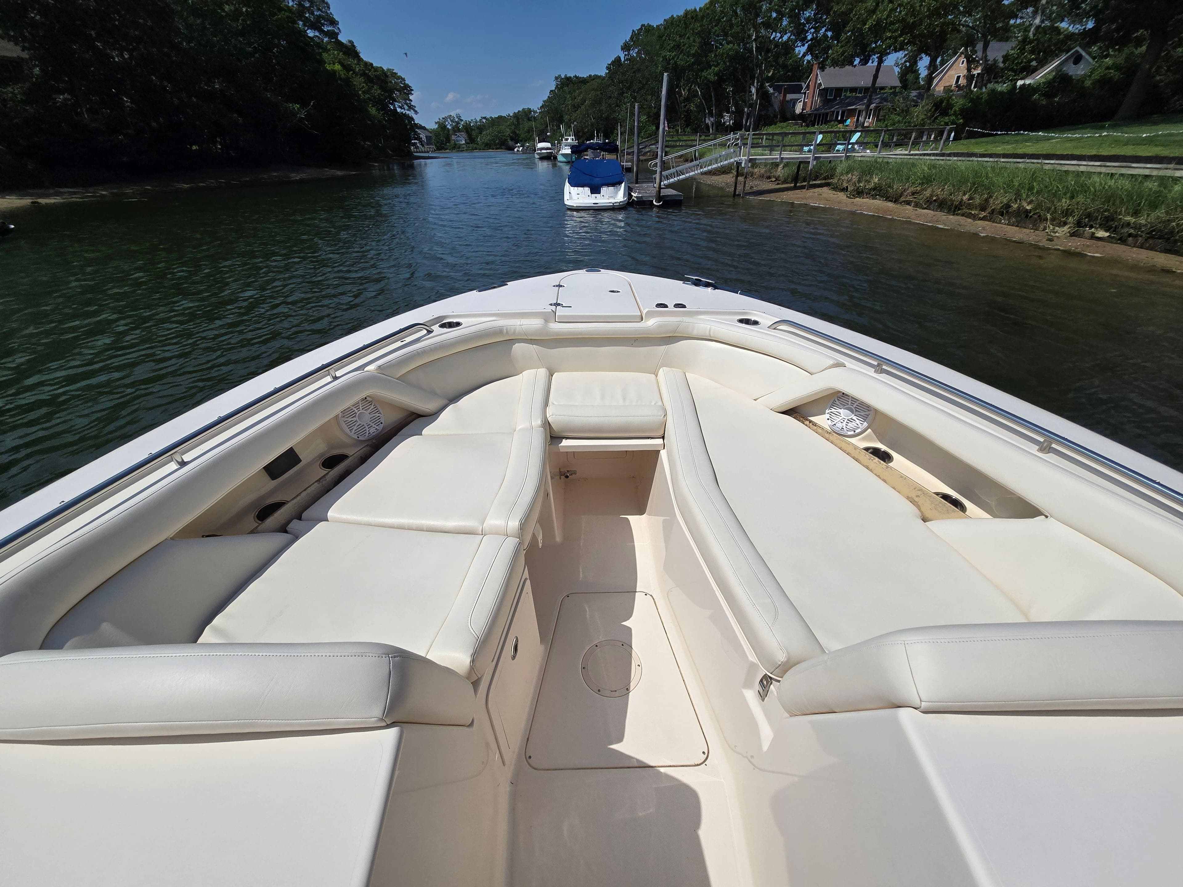 2017 Grady-White Freedom 335 boat interior with spacious seating on a calm waterway.