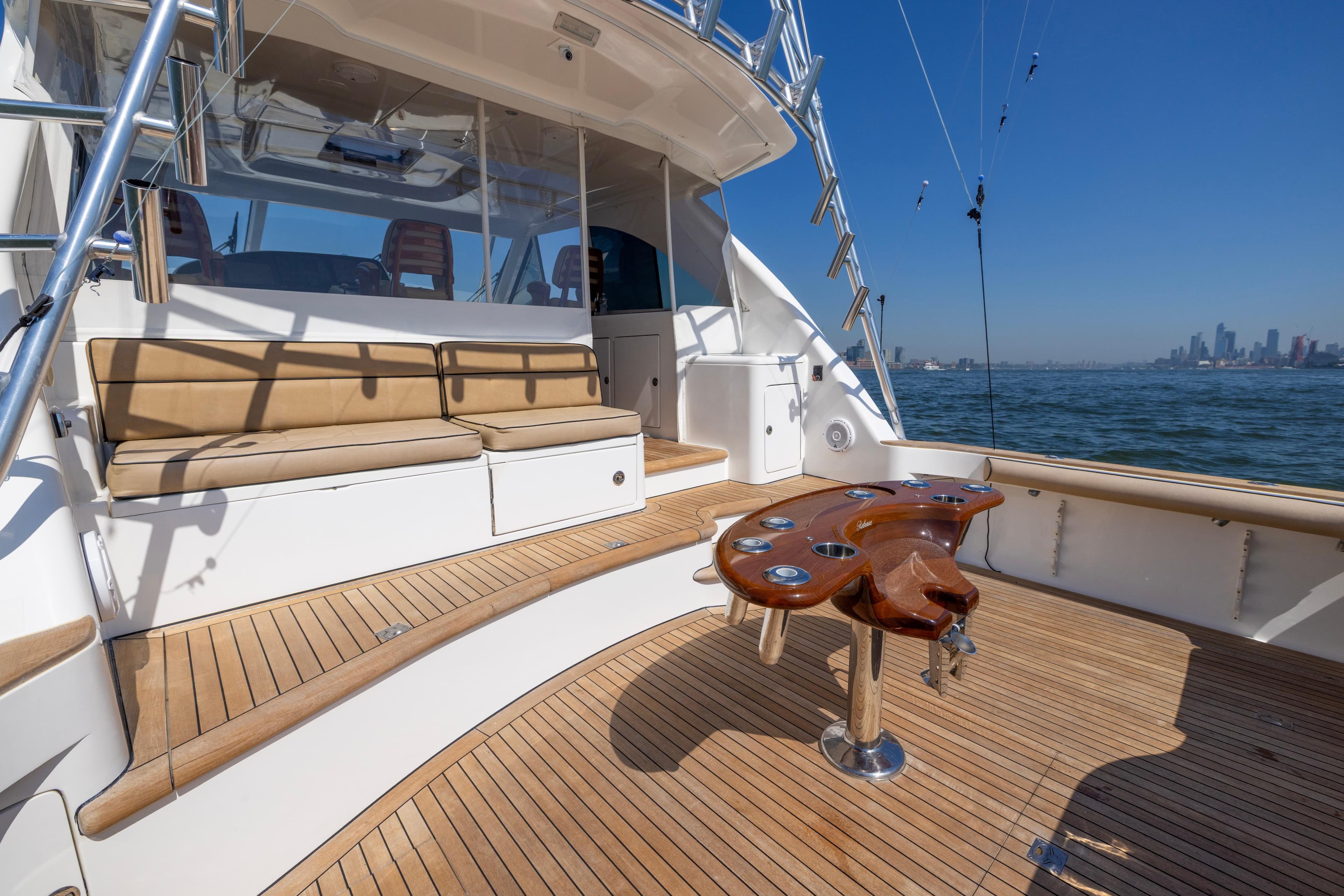 2012 Cabo 44 Hardtop Express yacht deck with seating and ocean view.