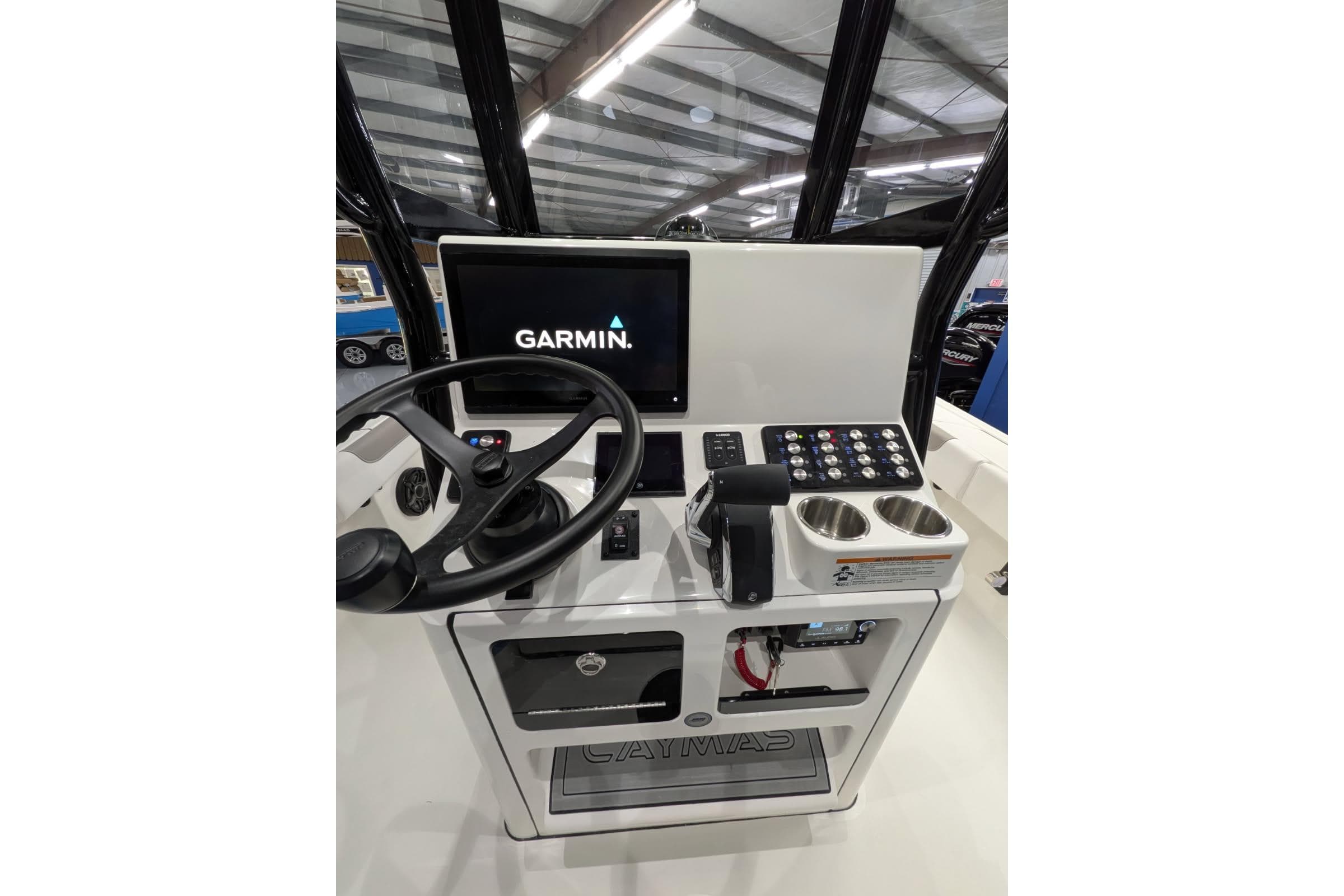 2026 Caymas 28 HB boat console with Garmin display and controls.
