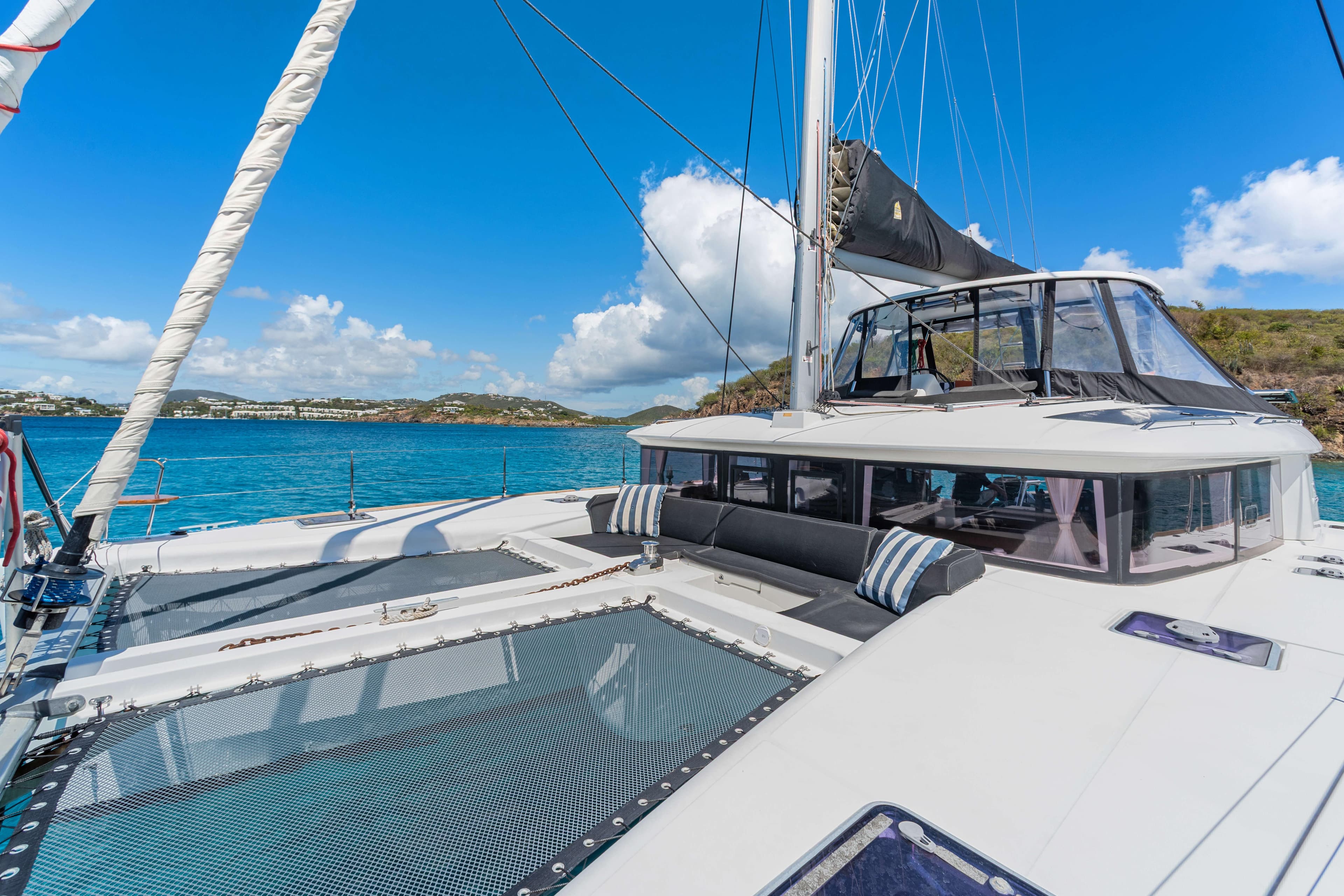 2017 Lagoon 450 F catamaran on clear blue water, featuring spacious deck and seating area.
