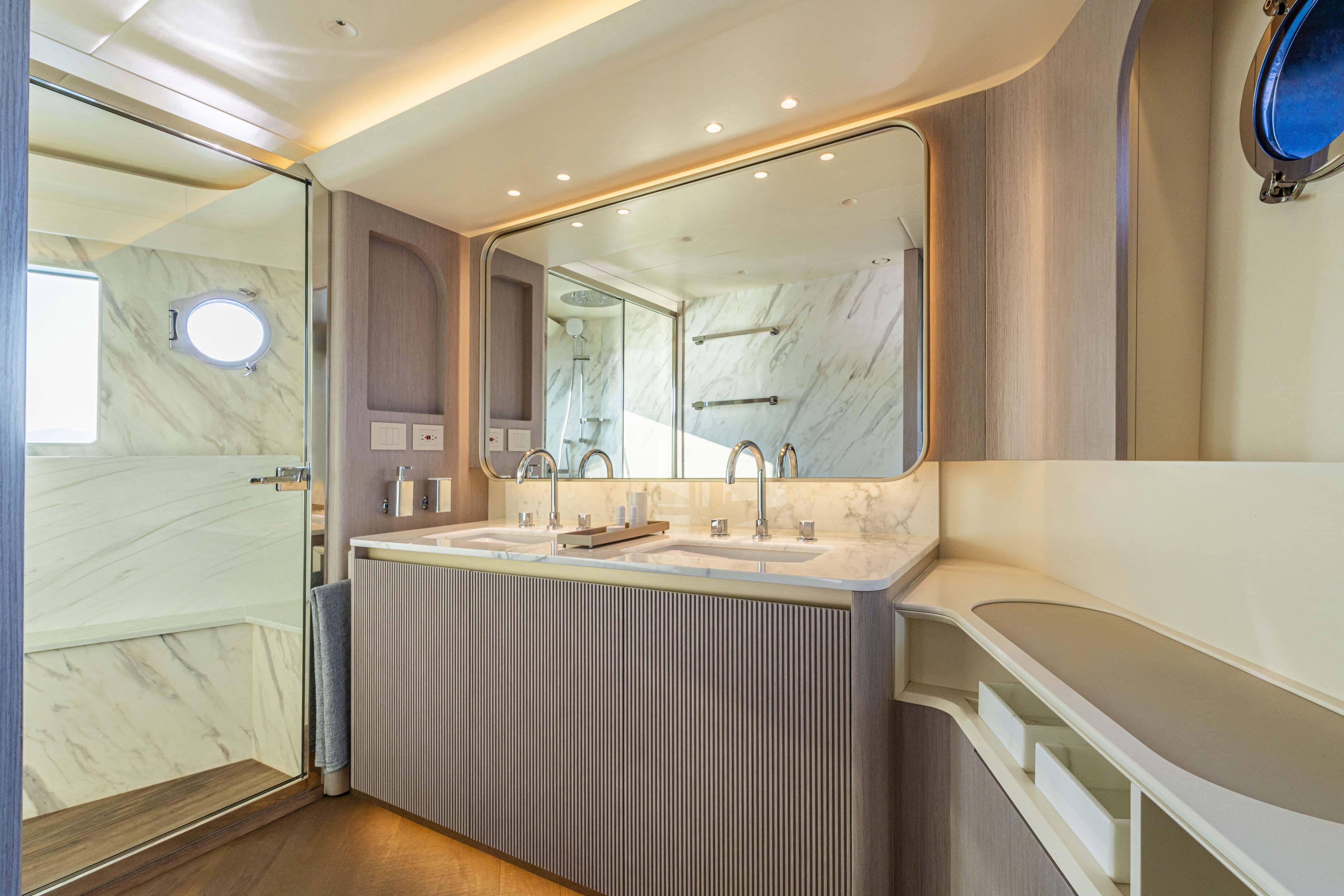 Luxurious bathroom in 2026 Absolute 70' Navetta yacht with dual sinks and modern design.
