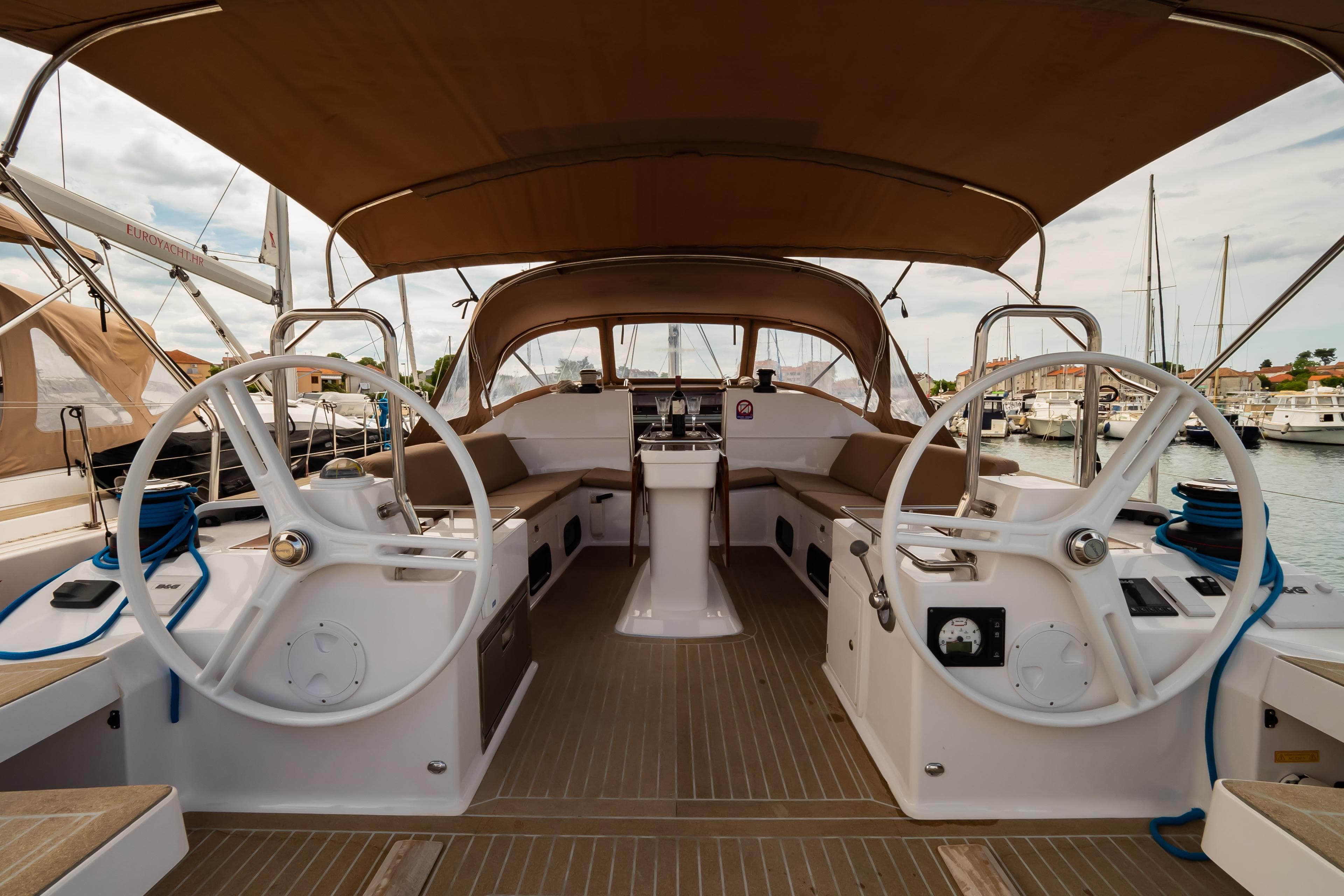 2018 Elan Impression 50 yacht cockpit with dual steering wheels and spacious seating.