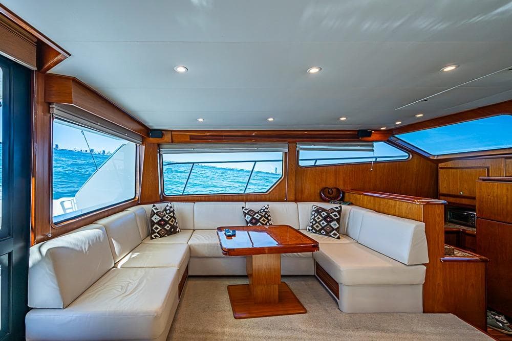 Luxurious interior of 2013 Mikelson Luxury Sportfisher yacht with ocean view.