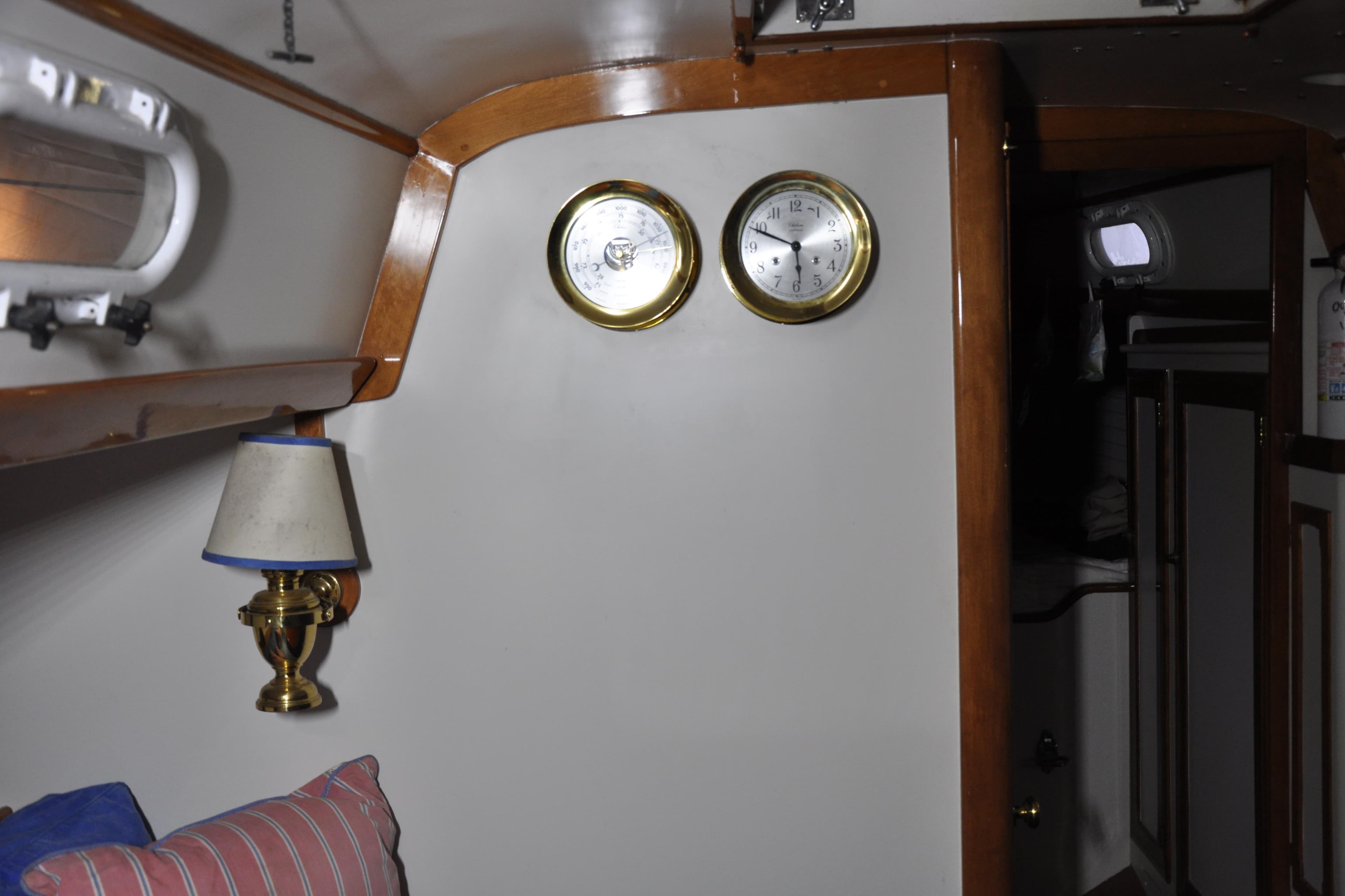 Interior of 1970 Hinckley Bermuda 40 yacht with brass clock and barometer.