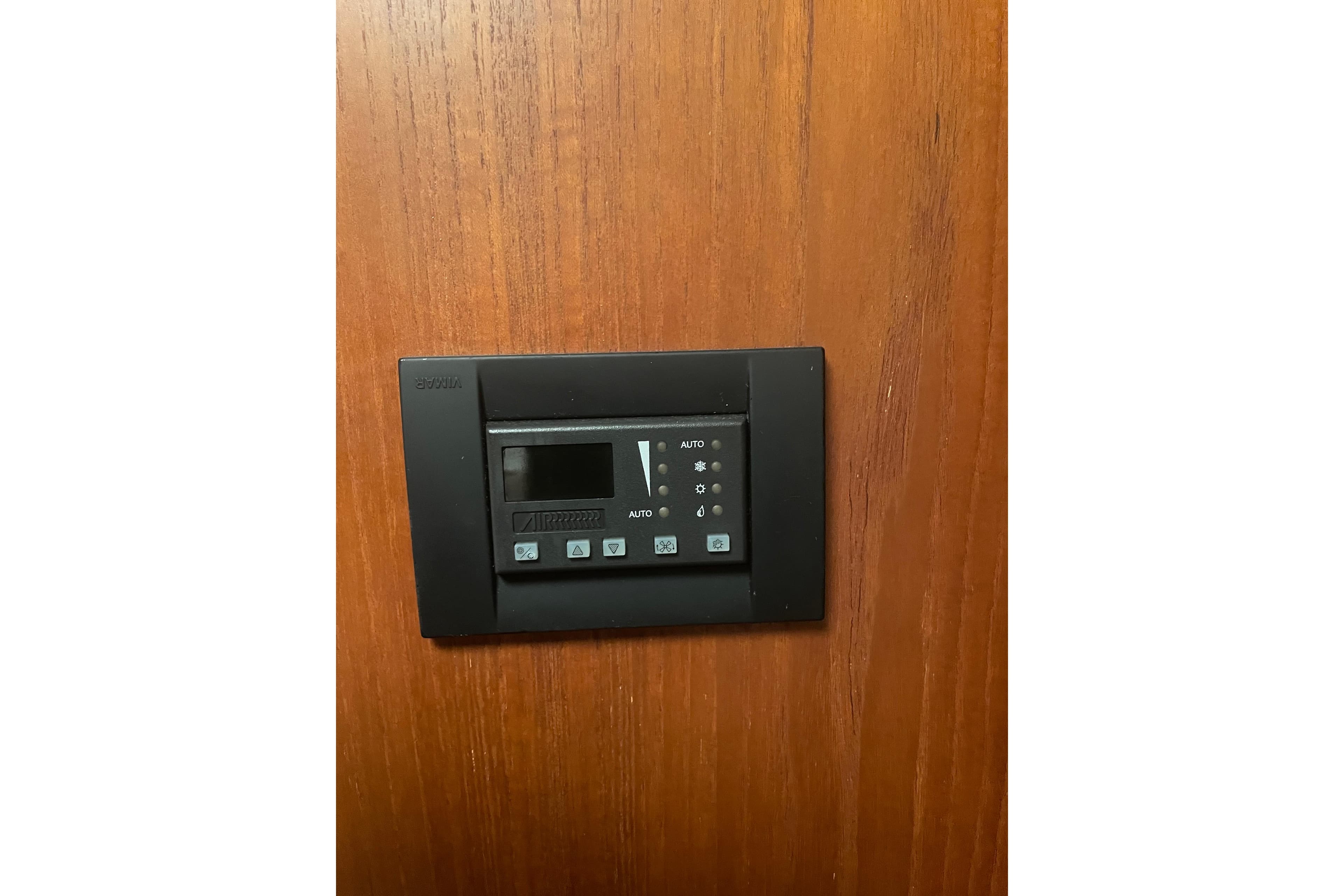 Control panel on 2006 Tiara Yachts 3800 Open, mounted on wooden surface.