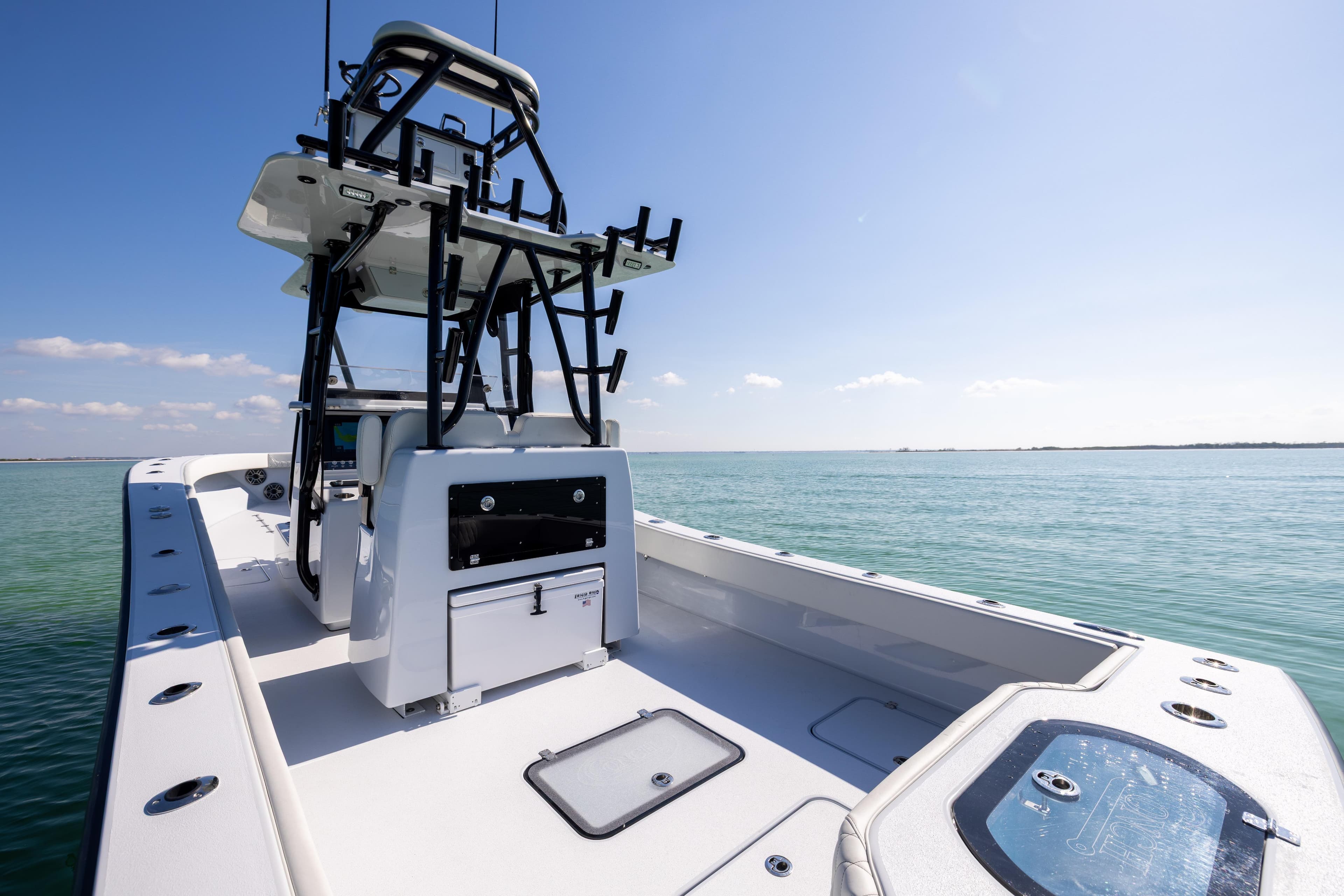 2025 Conch 33 boat on calm ocean waters under clear blue sky.