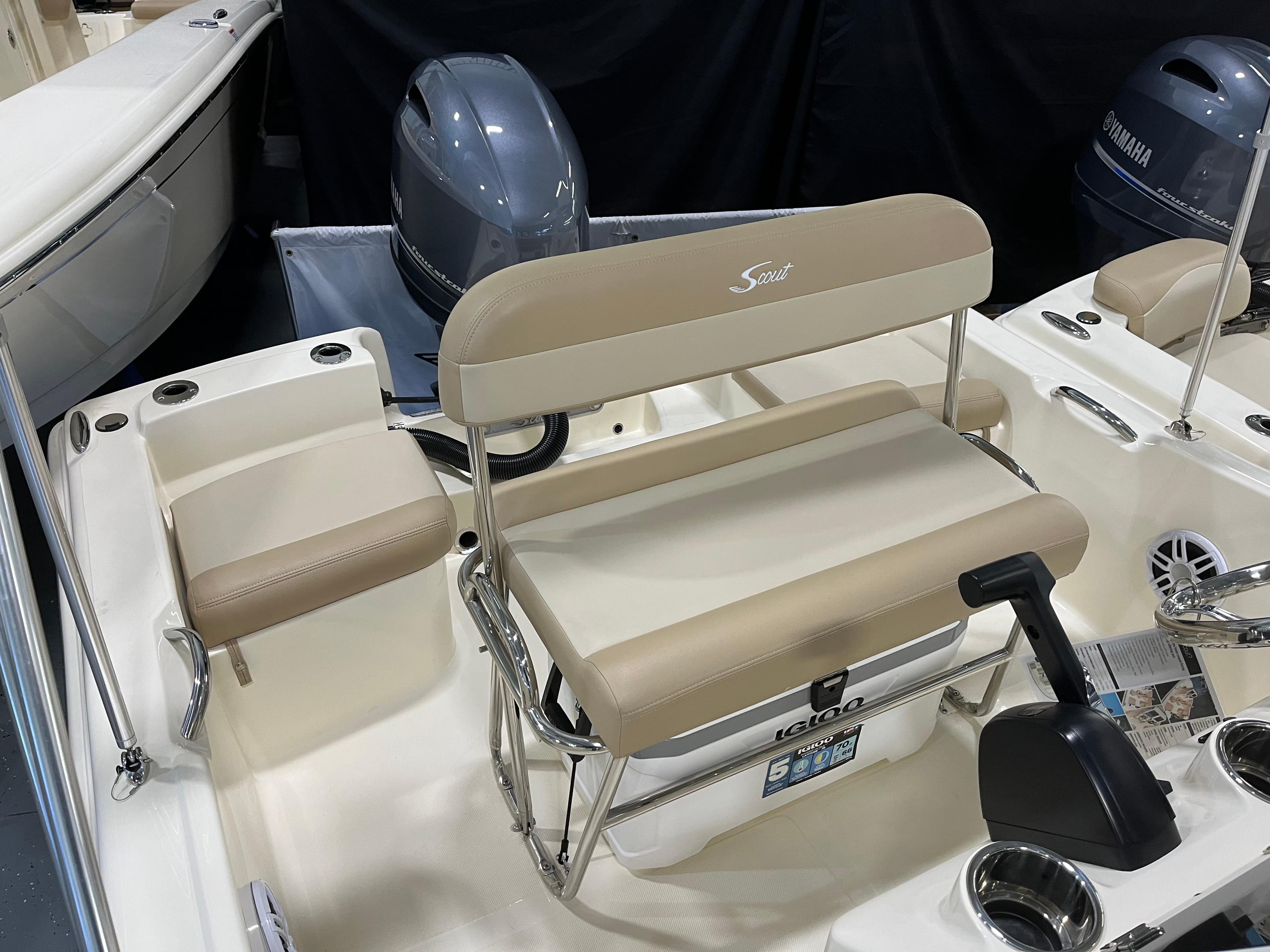 2024 Scout 175 Sportfish boat interior with seating and motor.