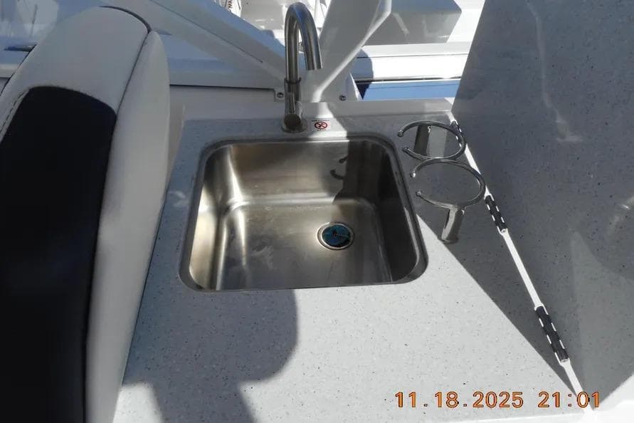 Stainless steel sink on 2026 Sea Fox 268 Traveler boat with cup holders.