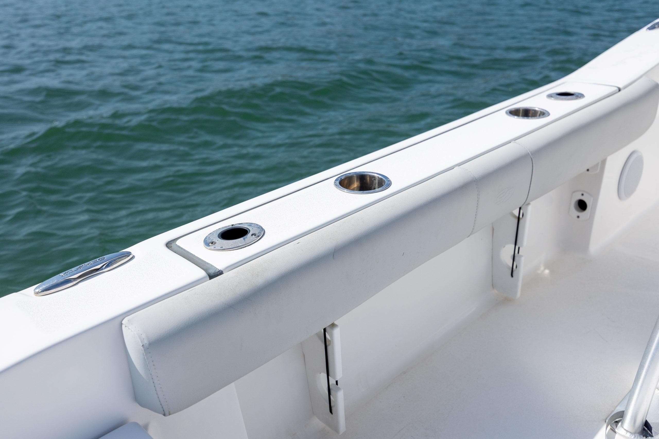2020 Sea Fox 206 Commander boat interior with rod holders, on calm water.