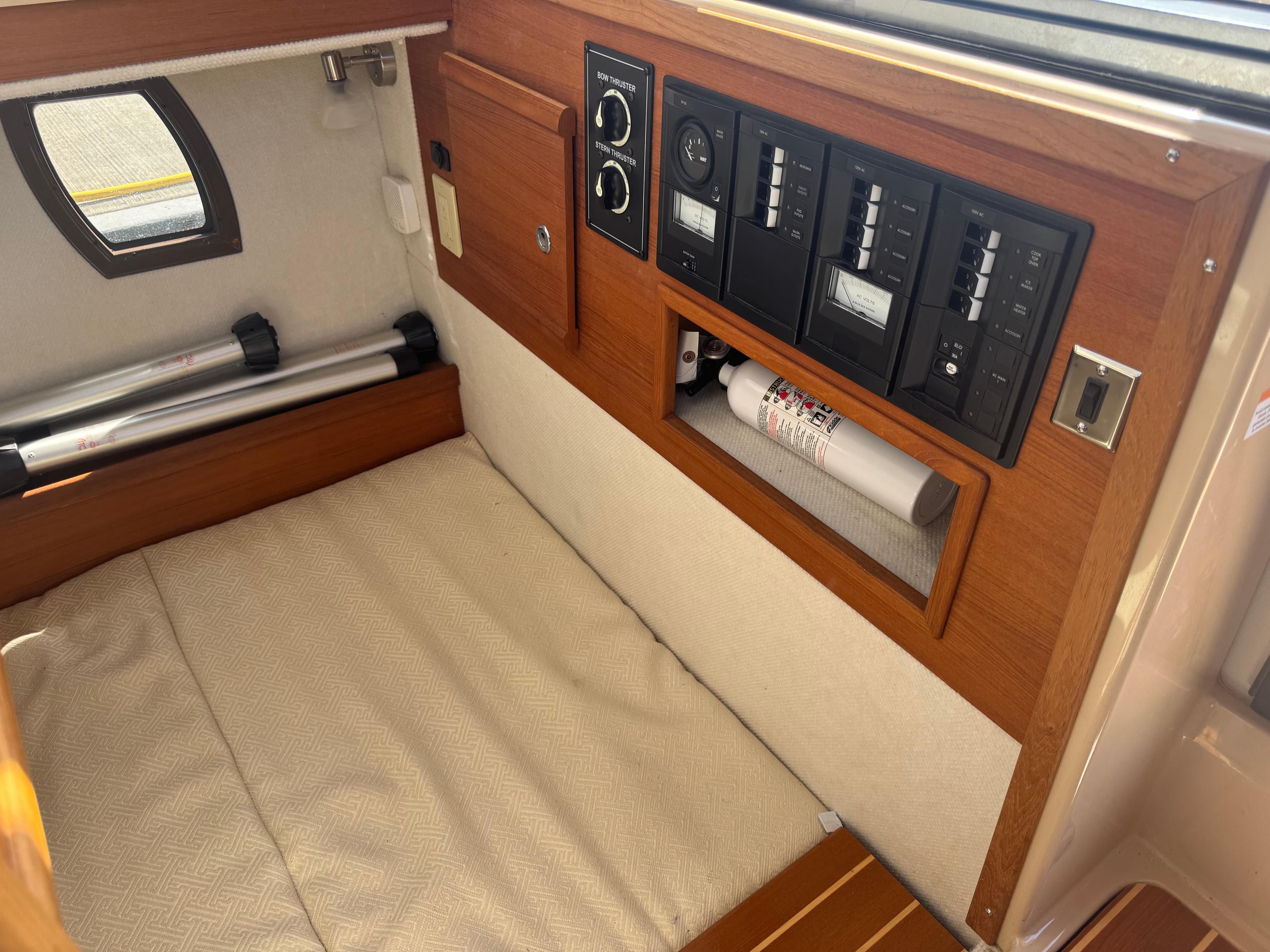 2019 Ranger Tugs R-29 CB interior with control panel and fire extinguisher.