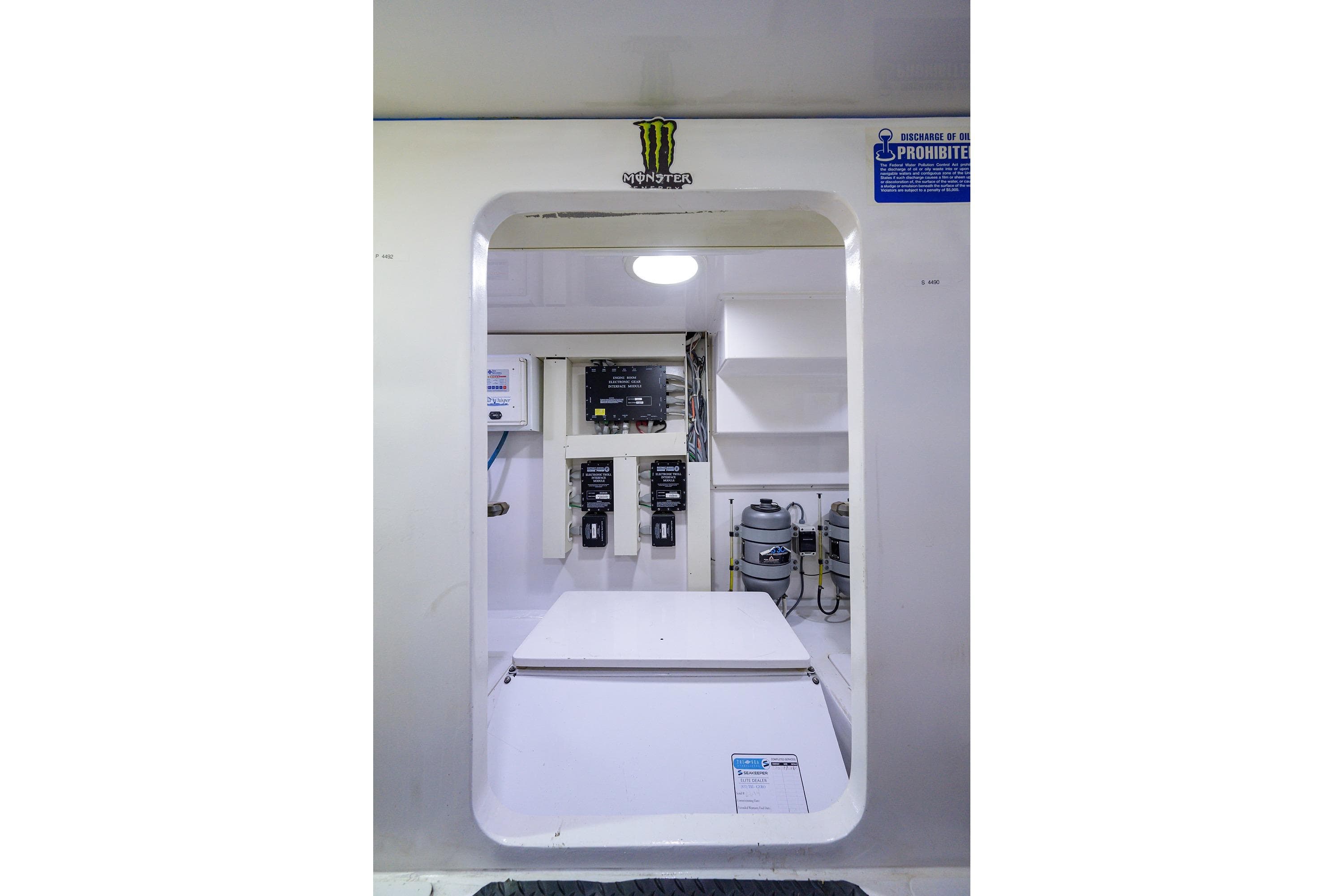Engine room of a 2005 Viking 61 yacht, featuring control panels and equipment.