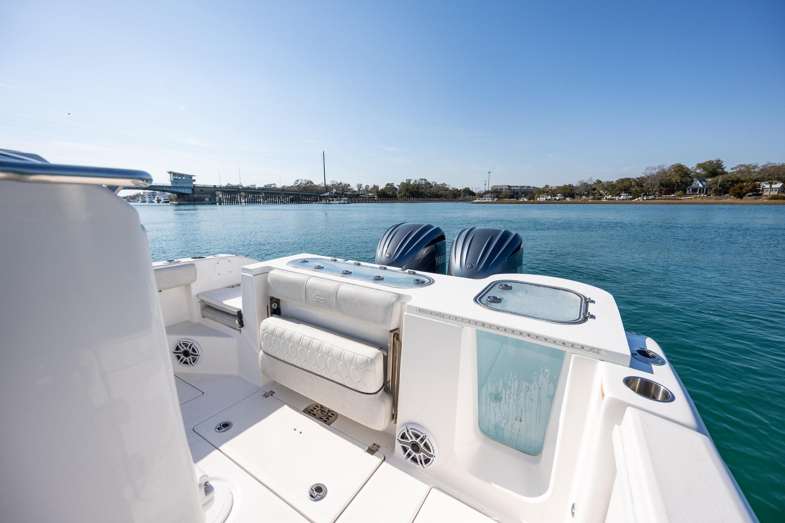 2023 Sea Fox 288 Commander boat on calm water, featuring dual engines and spacious deck.