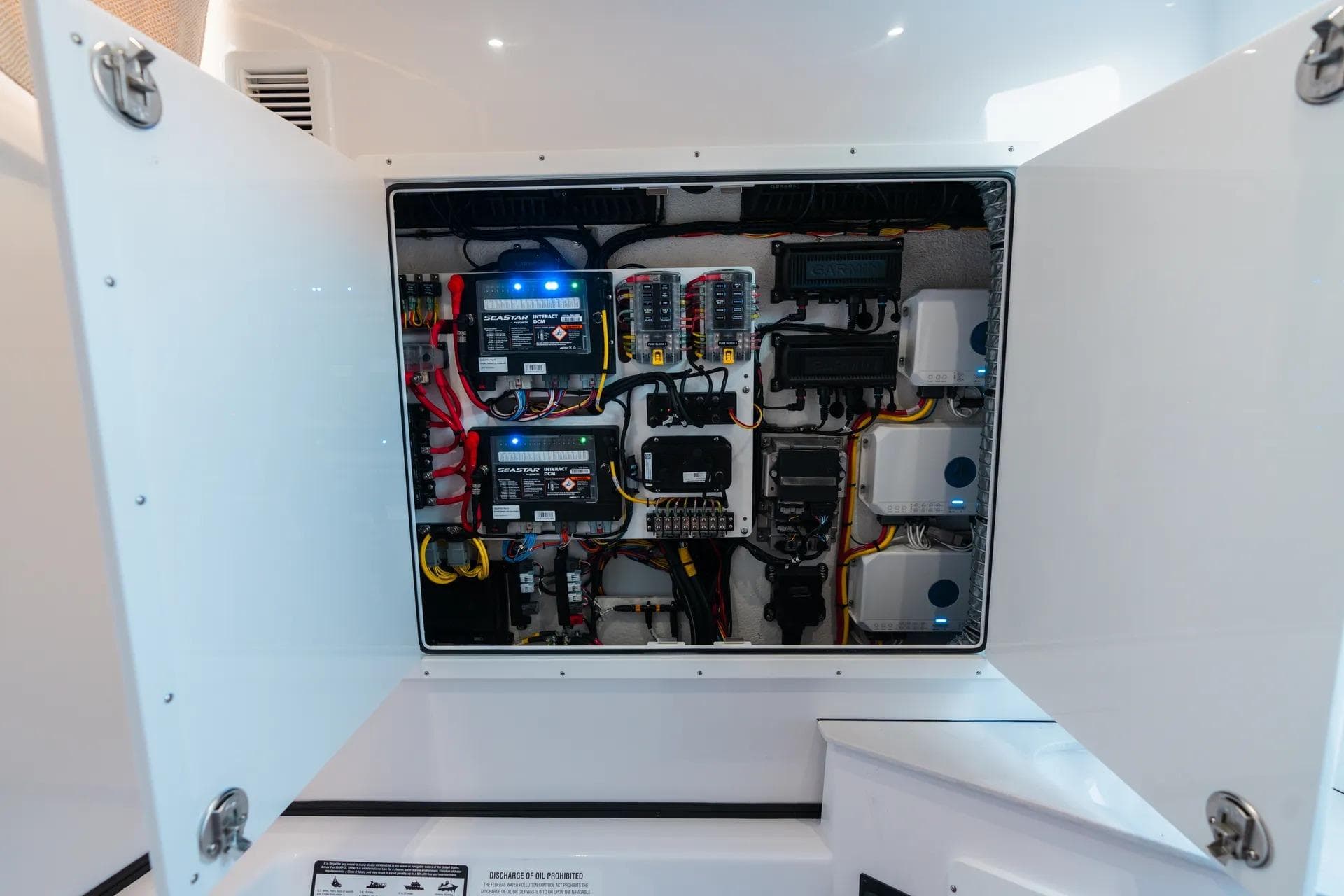 Electrical panel inside 2026 Sportsman Open 352 Center Console boat, showcasing wiring and components.