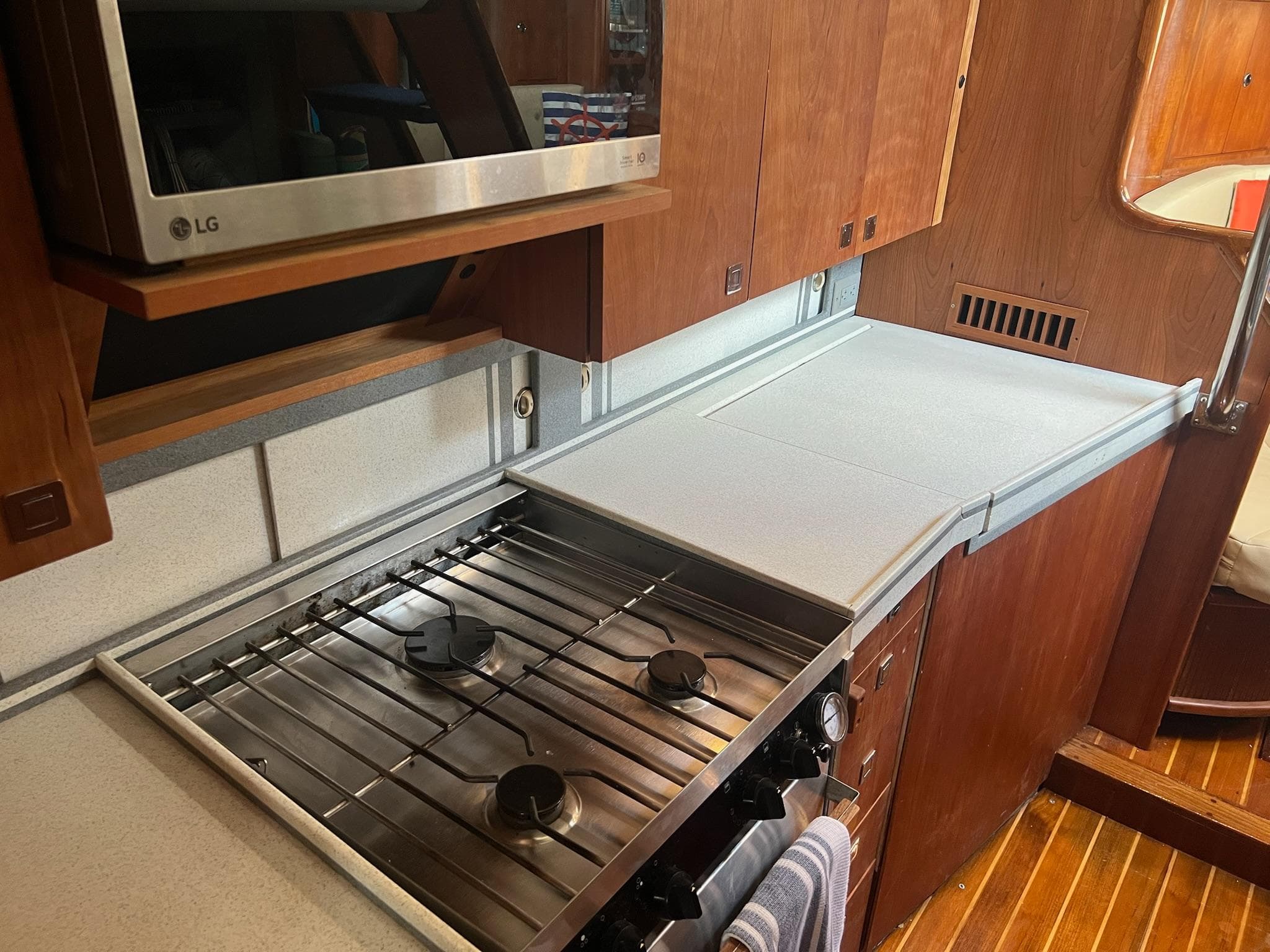 Galley kitchen in 1992 Endeavour 45 yacht with stove and microwave.