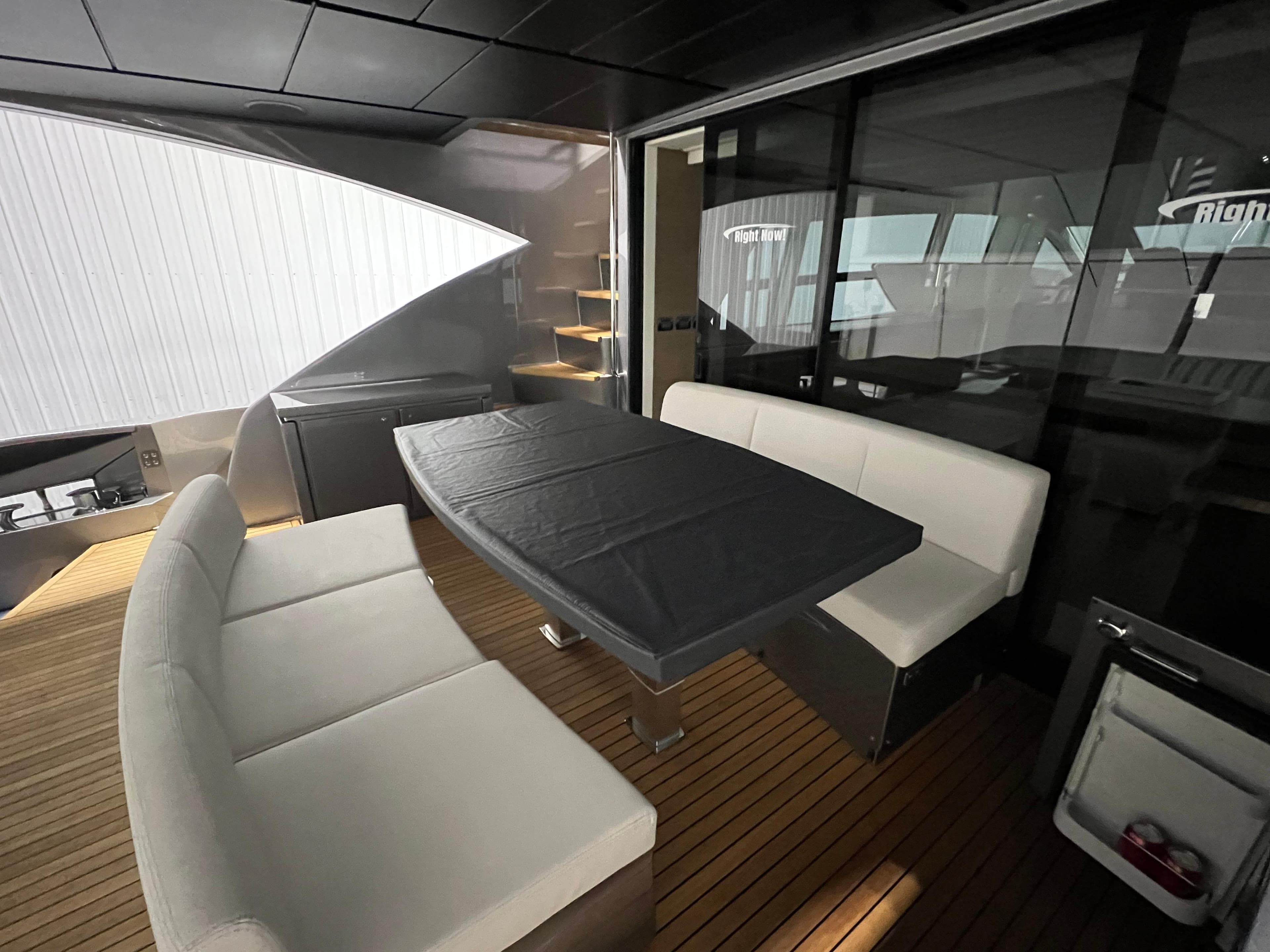 Luxurious 2017 Pershing 92 Motor Yacht interior with elegant seating and dining area.