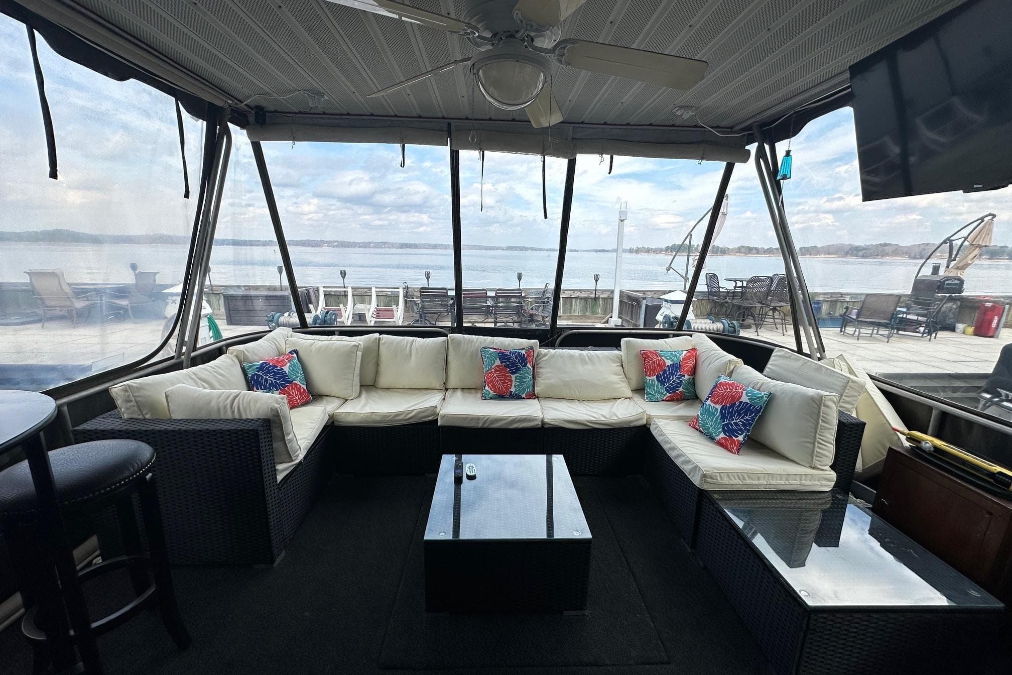 Luxurious 1993 Sumerset 14x65 houseboat interior with cozy seating and lake view.