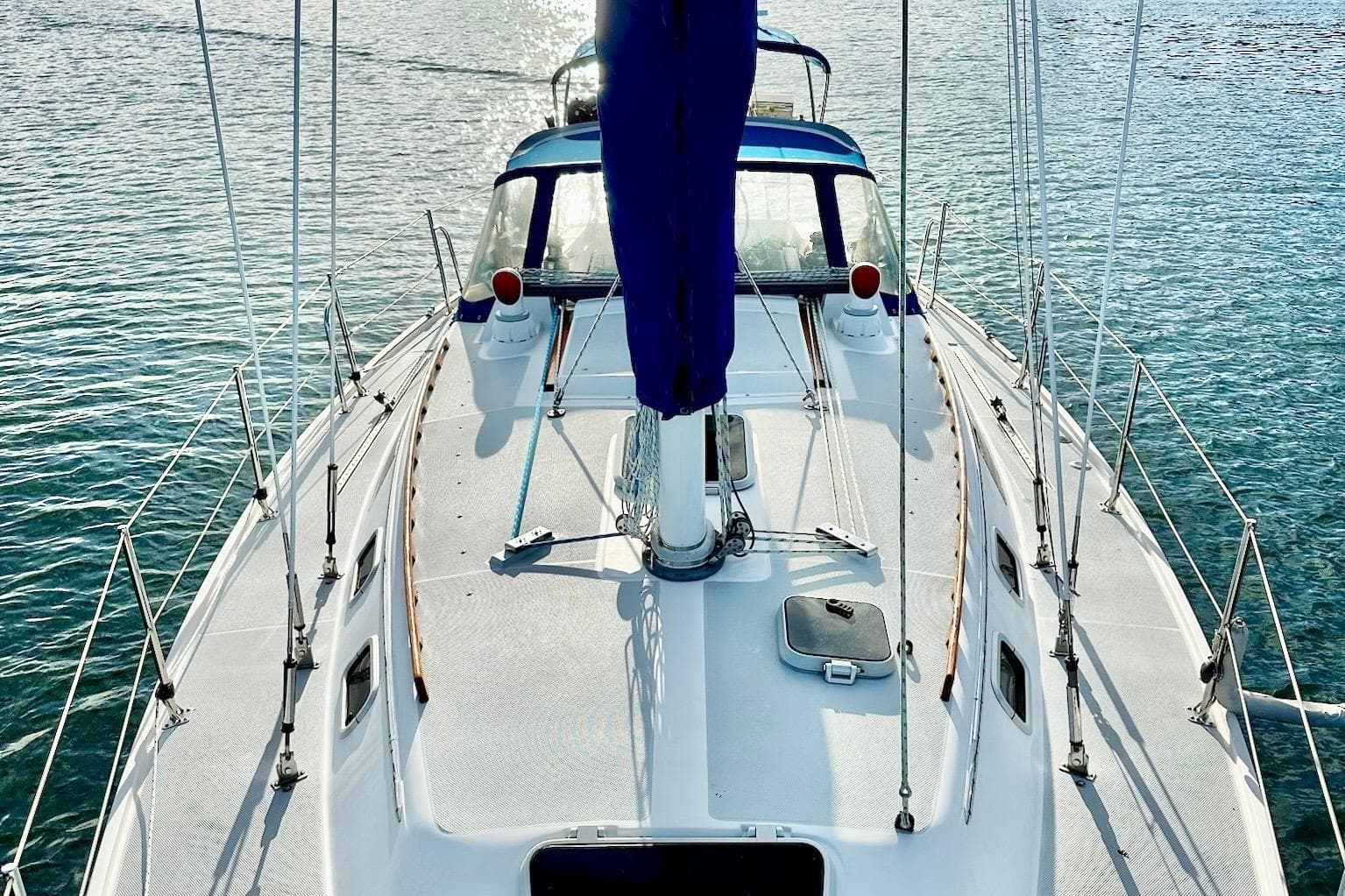 Sailboat Catalina 36 MK1, 1992 model, on calm water, viewed from above.
