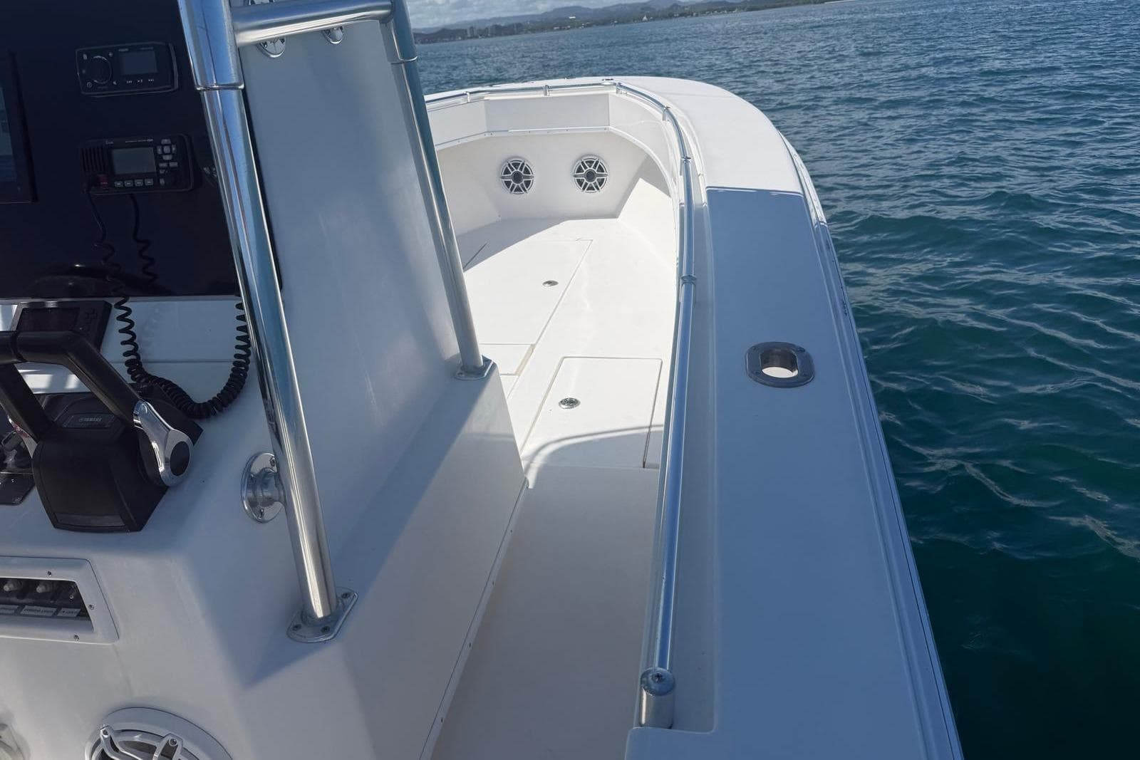 2004 Contender 28 Tournament boat on water, featuring sleek deck and control panel.