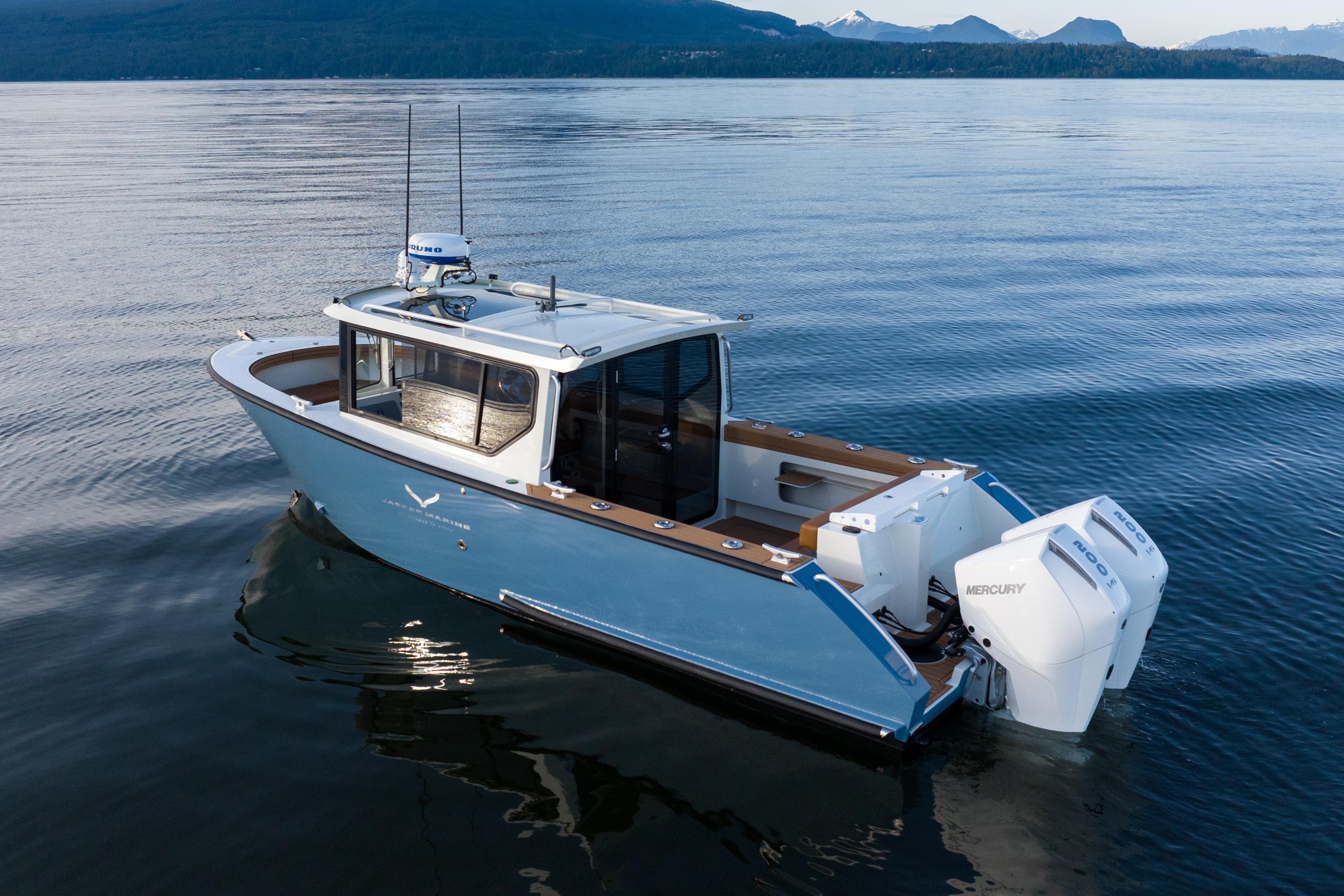 2026 Jasper Marine Defender 22 boat on calm water with twin Mercury engines.