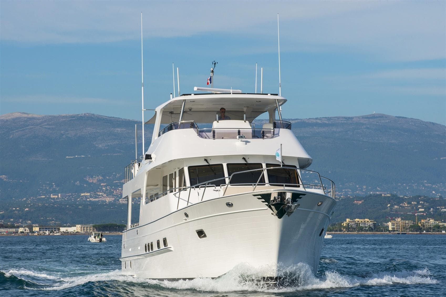 2027 Outer Reef Yachts 640 Azure Motoryacht cruising on open water.