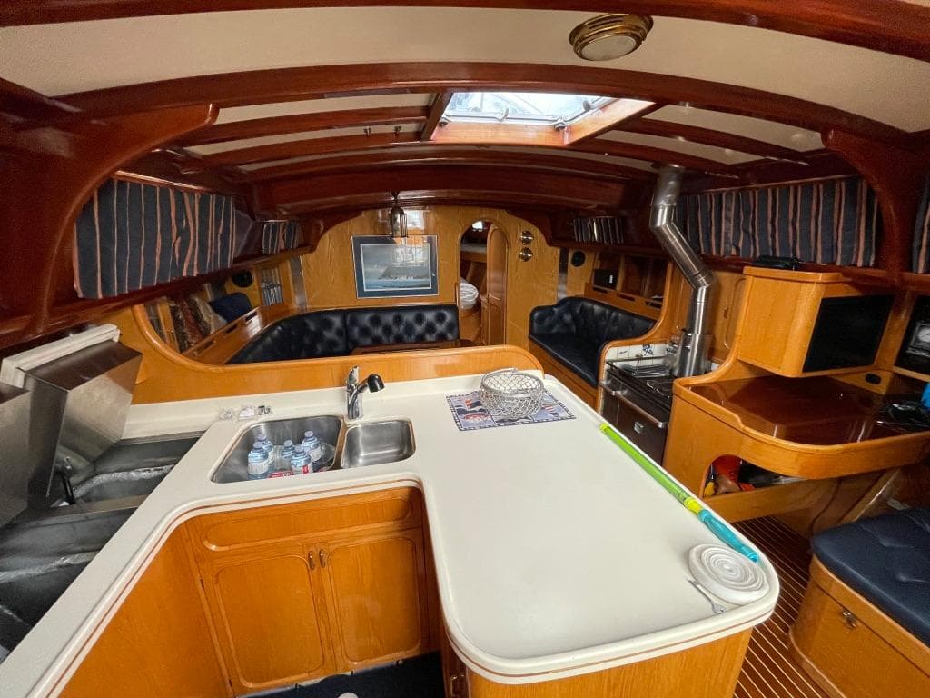 Luxurious 1988 Jespersen Peterson 53 yacht interior with wood finish and modern amenities.
