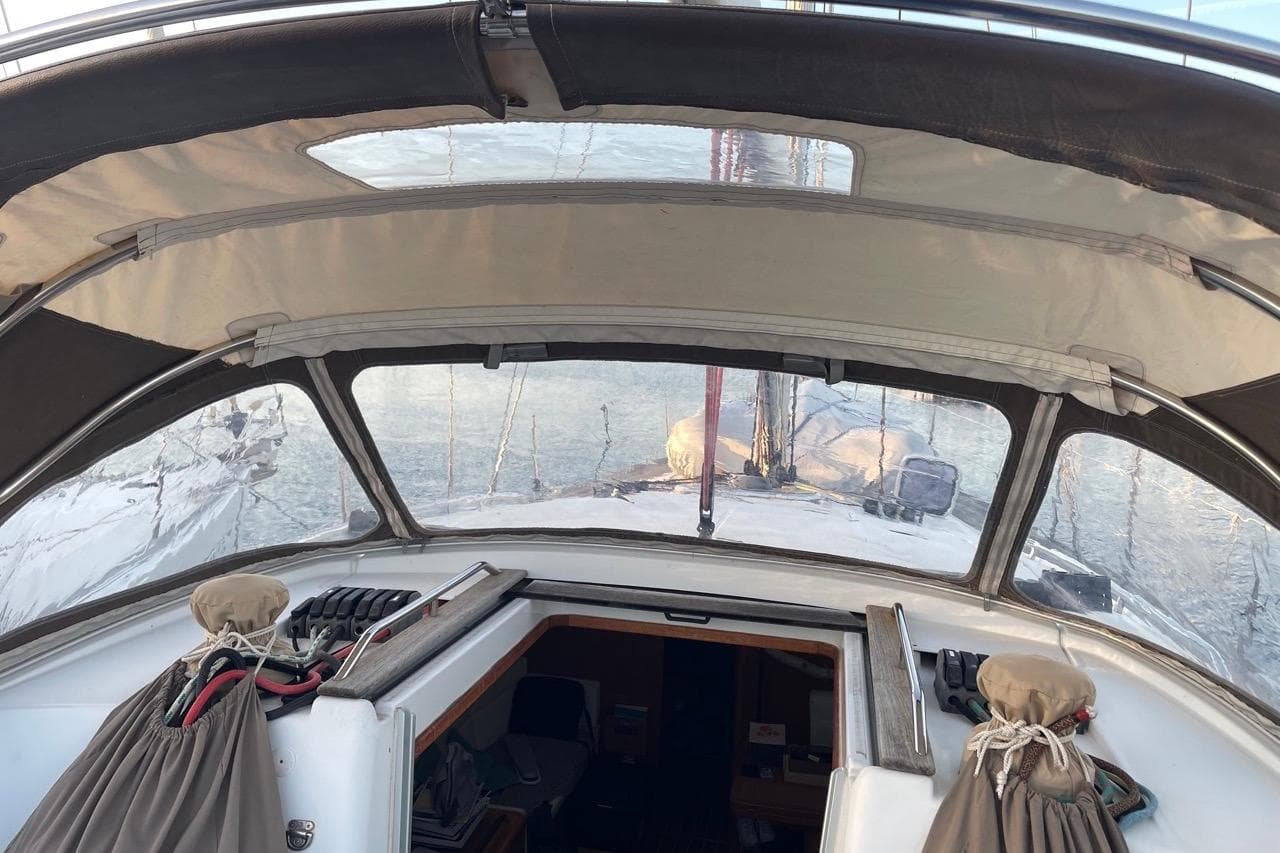 Cockpit view of 2015 Jeanneau Sun Odyssey 50 DS sailboat with covered helm.