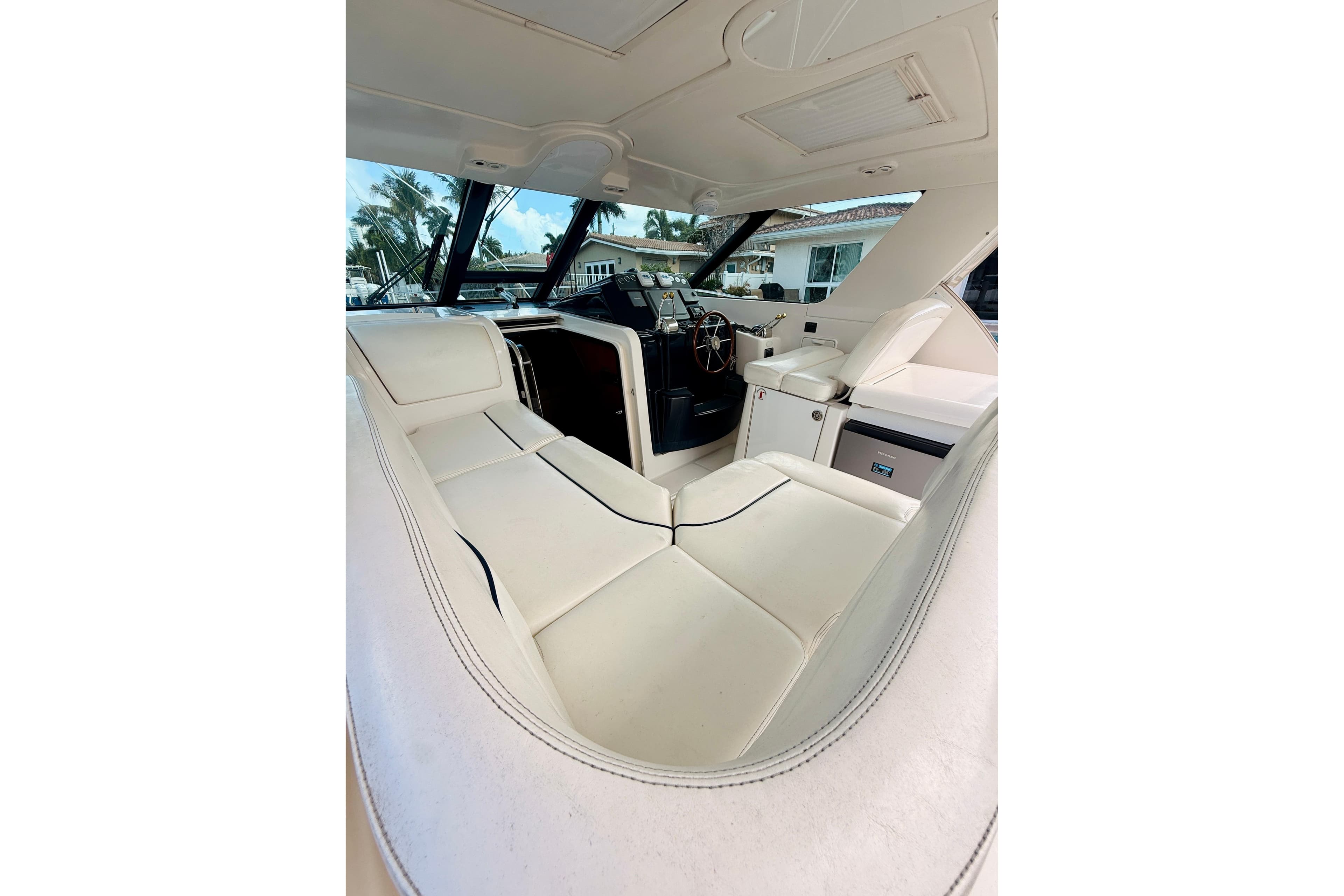 Interior view of 2005 Tiara Yachts 3600 Sovran, featuring luxurious seating and helm.