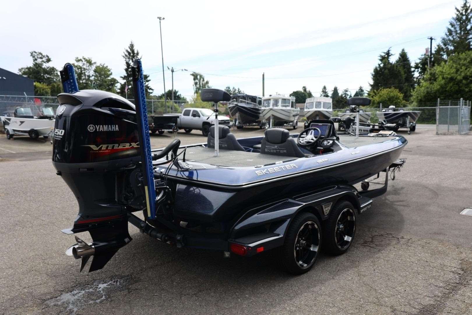 2018 Skeeter FX21 Limited Edition boat with Yamaha VMAX engine in a parking lot.