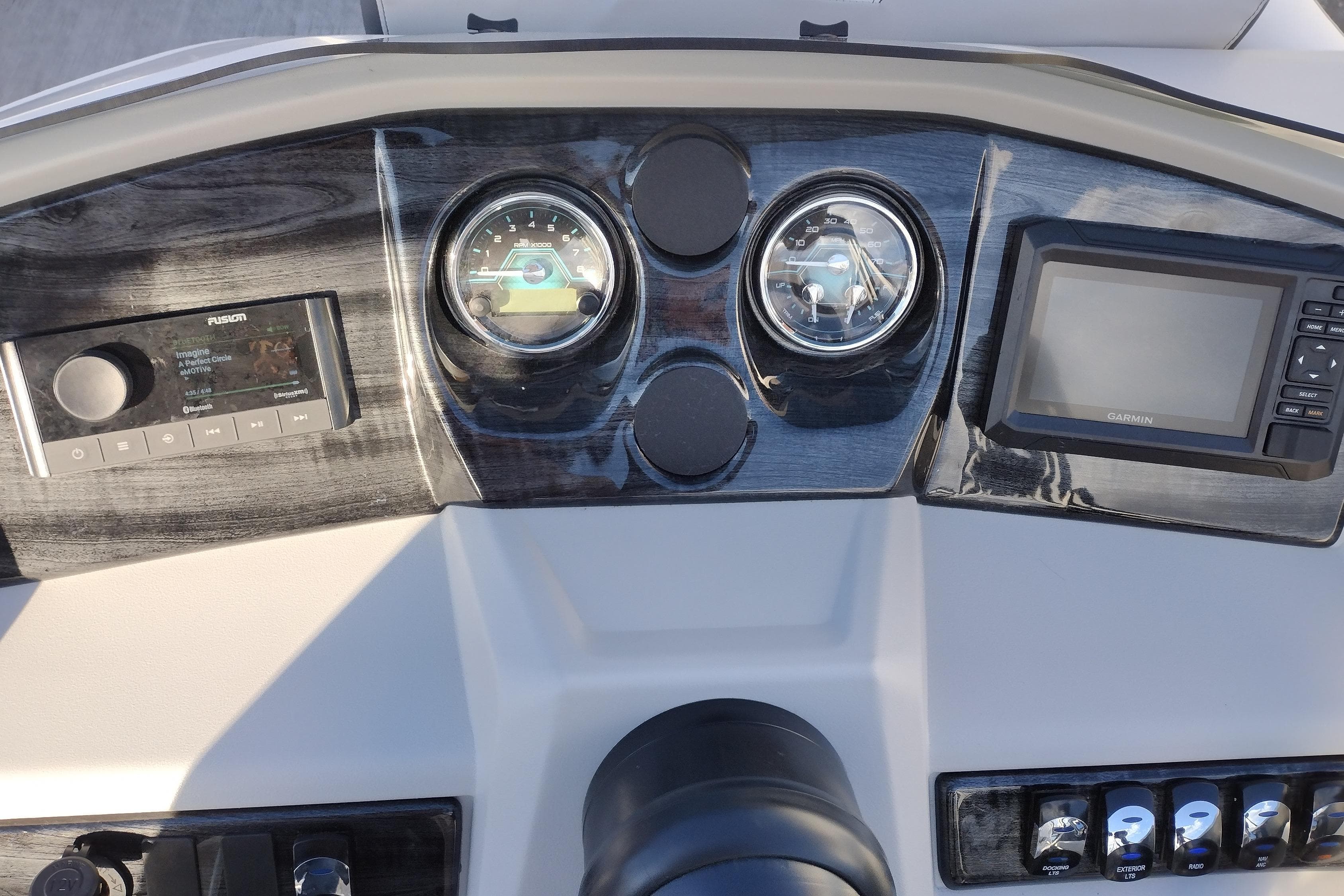 Dashboard of 2026 Tahoe Pontoon 25E85 LTZ with gauges and controls.