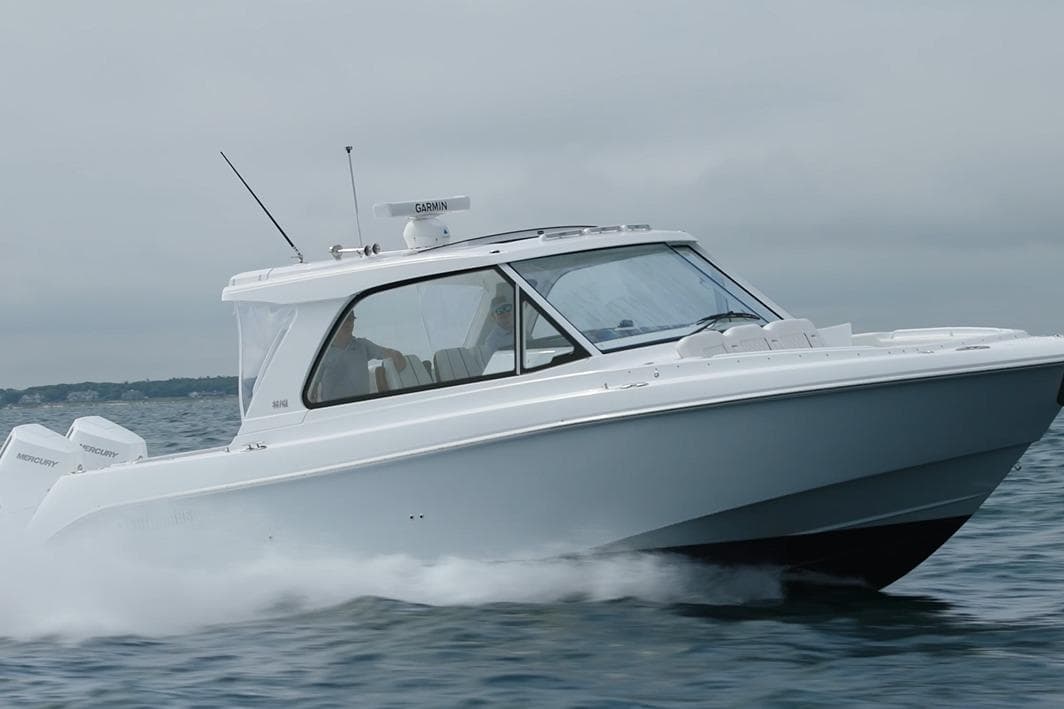 2026 Everglades 367 CX boat cruising on open water, showcasing sleek design and performance.