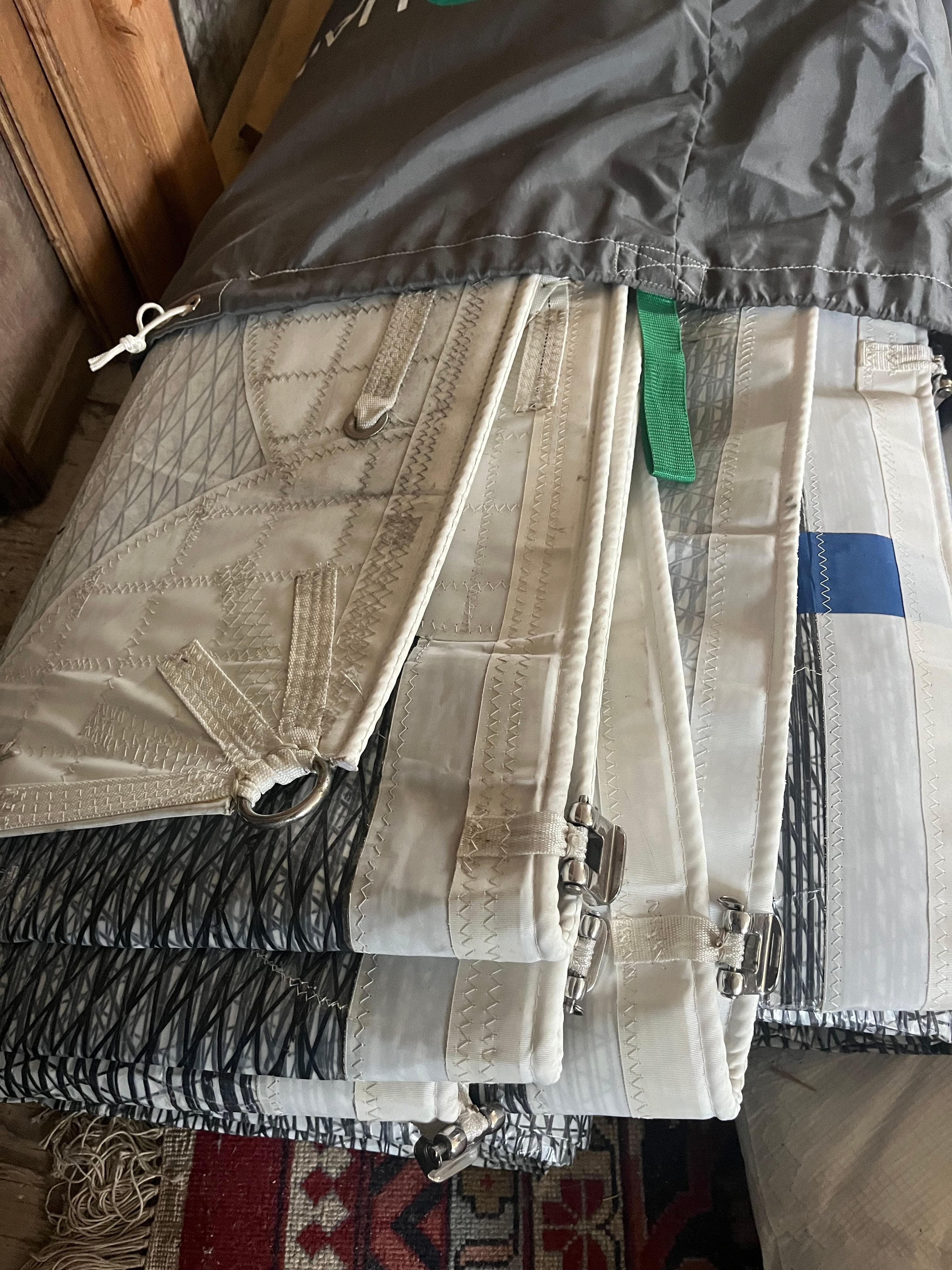Folded sail with intricate stitching, suitable for a 1980 C&C 34 sailboat.