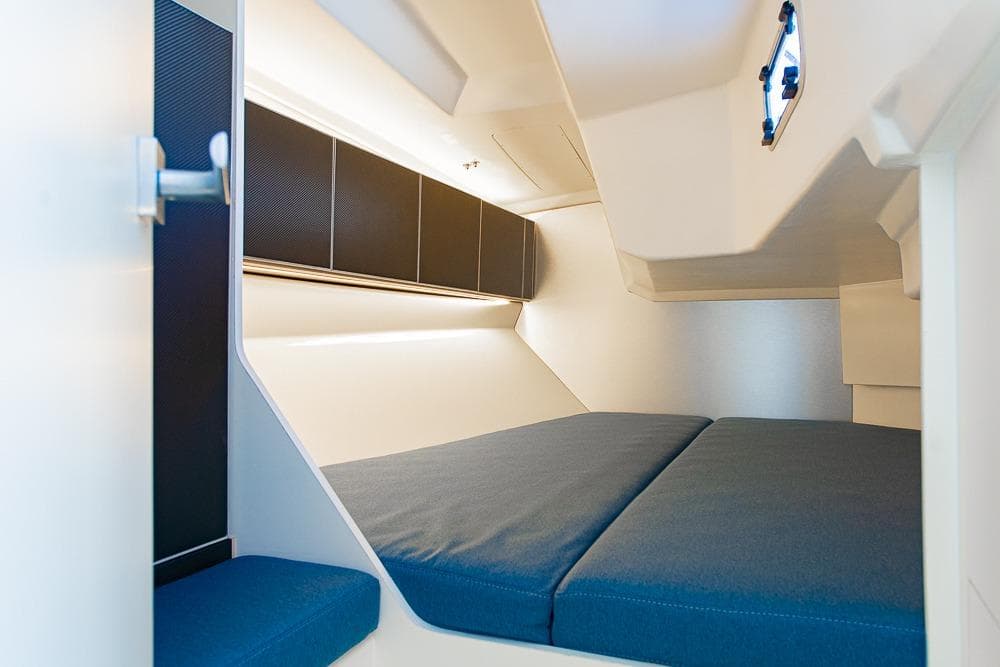 Italia Yachts 11.98 (2026) interior cabin with modern design and comfortable bedding.