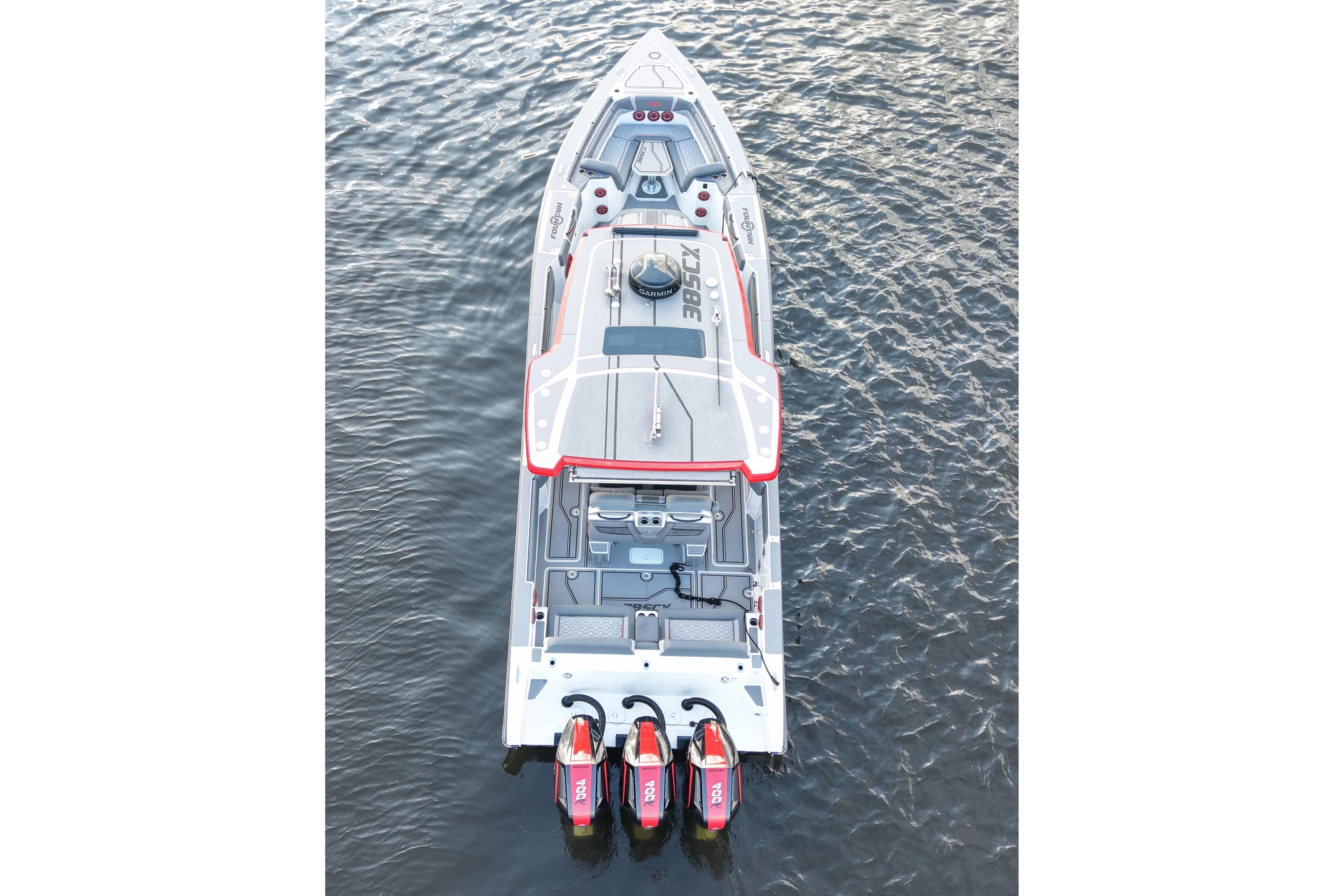 2025 Fountain 38 SCX boat on water, aerial view, featuring triple outboard engines.