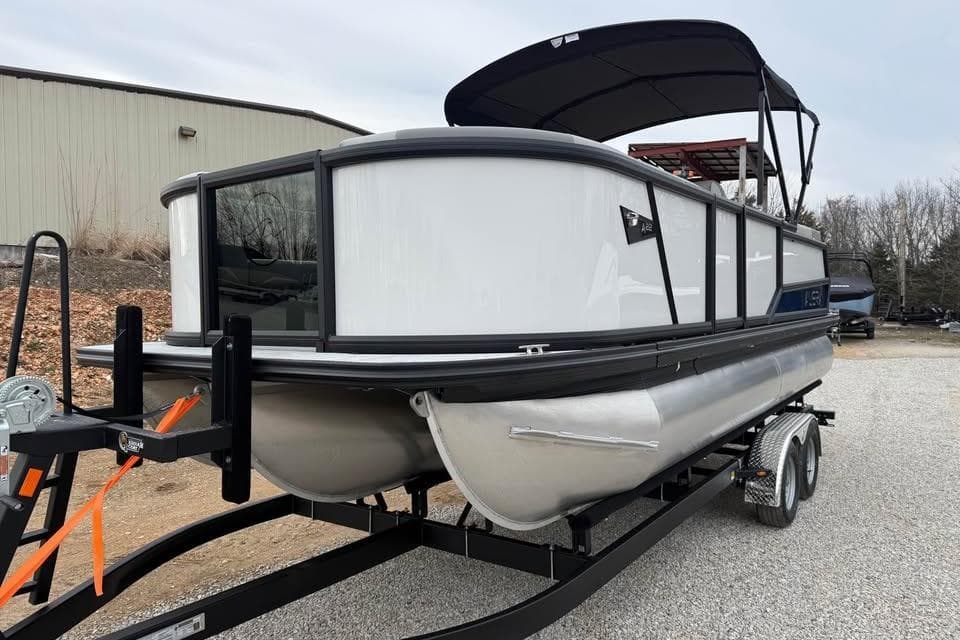 2026 Alara 22Q pontoon boat on trailer, featuring sleek design and canopy.