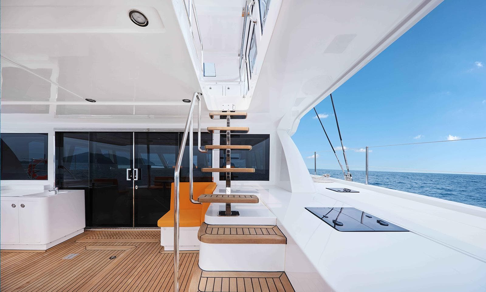 Luxurious Heysea 59 yacht interior with modern design, featuring wooden stairs and ocean view, 2026 model.