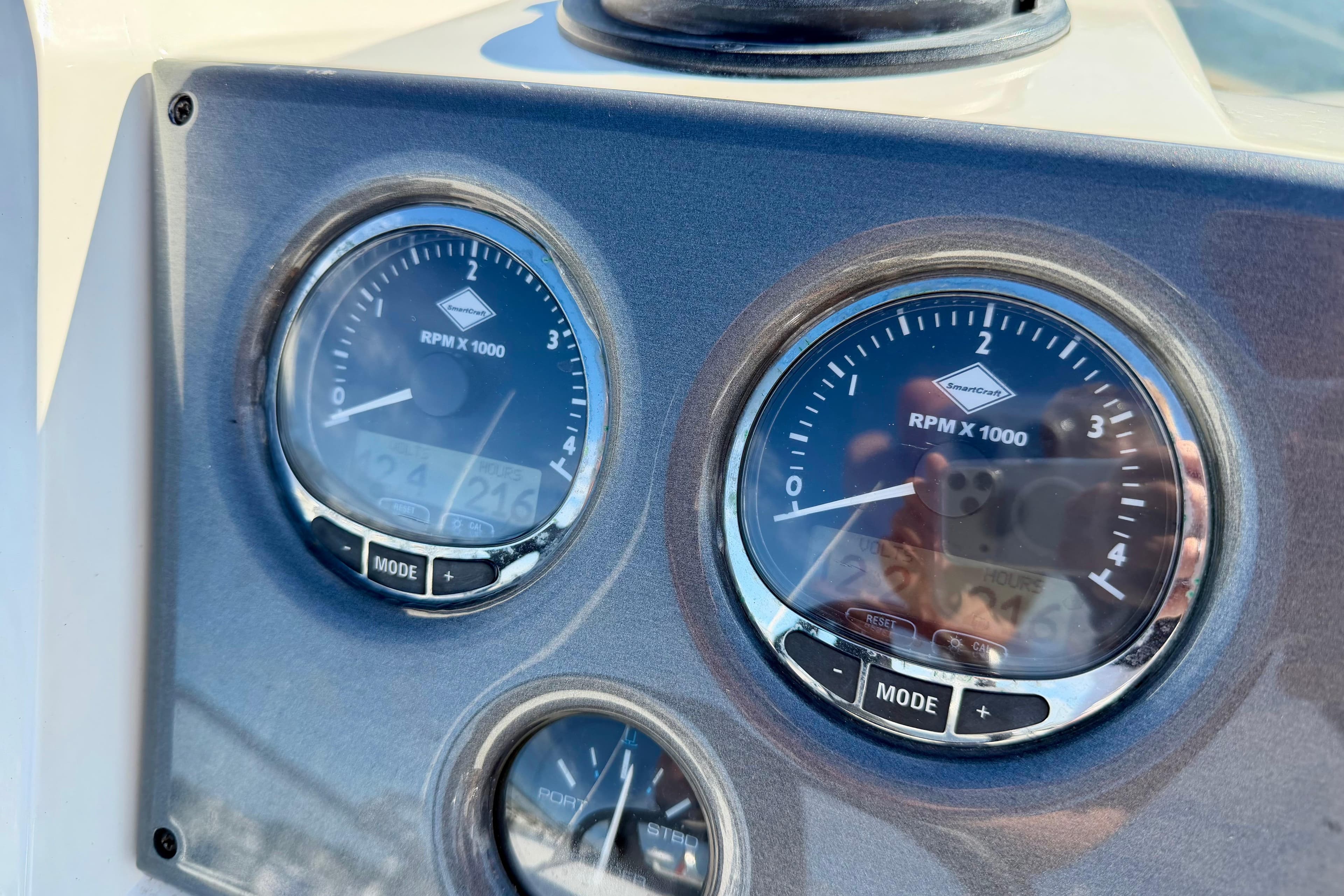 Close-up of 2009 Sealine F42/5 boat dashboard with RPM gauges.
