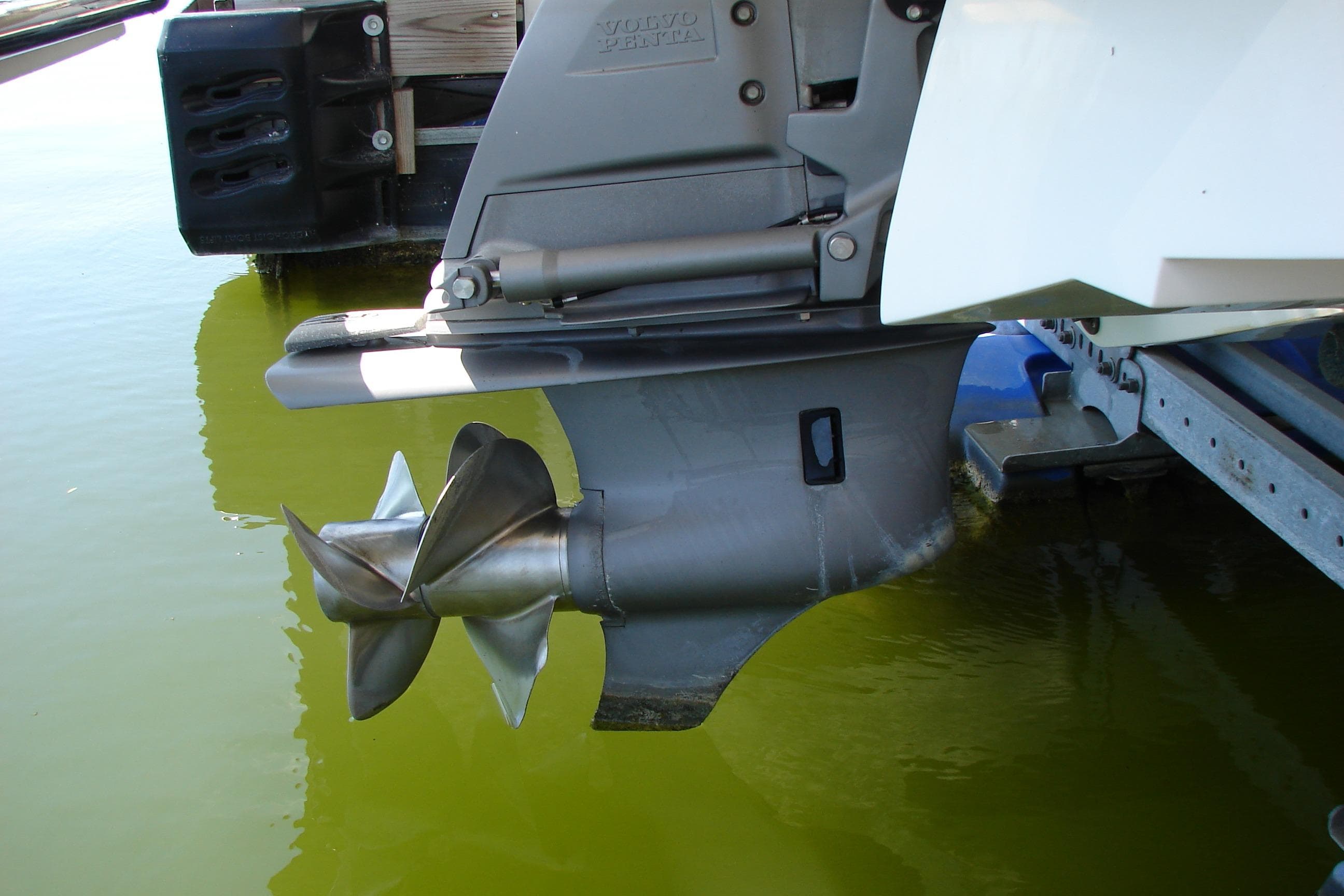 2011 Cobalt 232 boat propeller in water, showcasing Volvo Penta drive system.