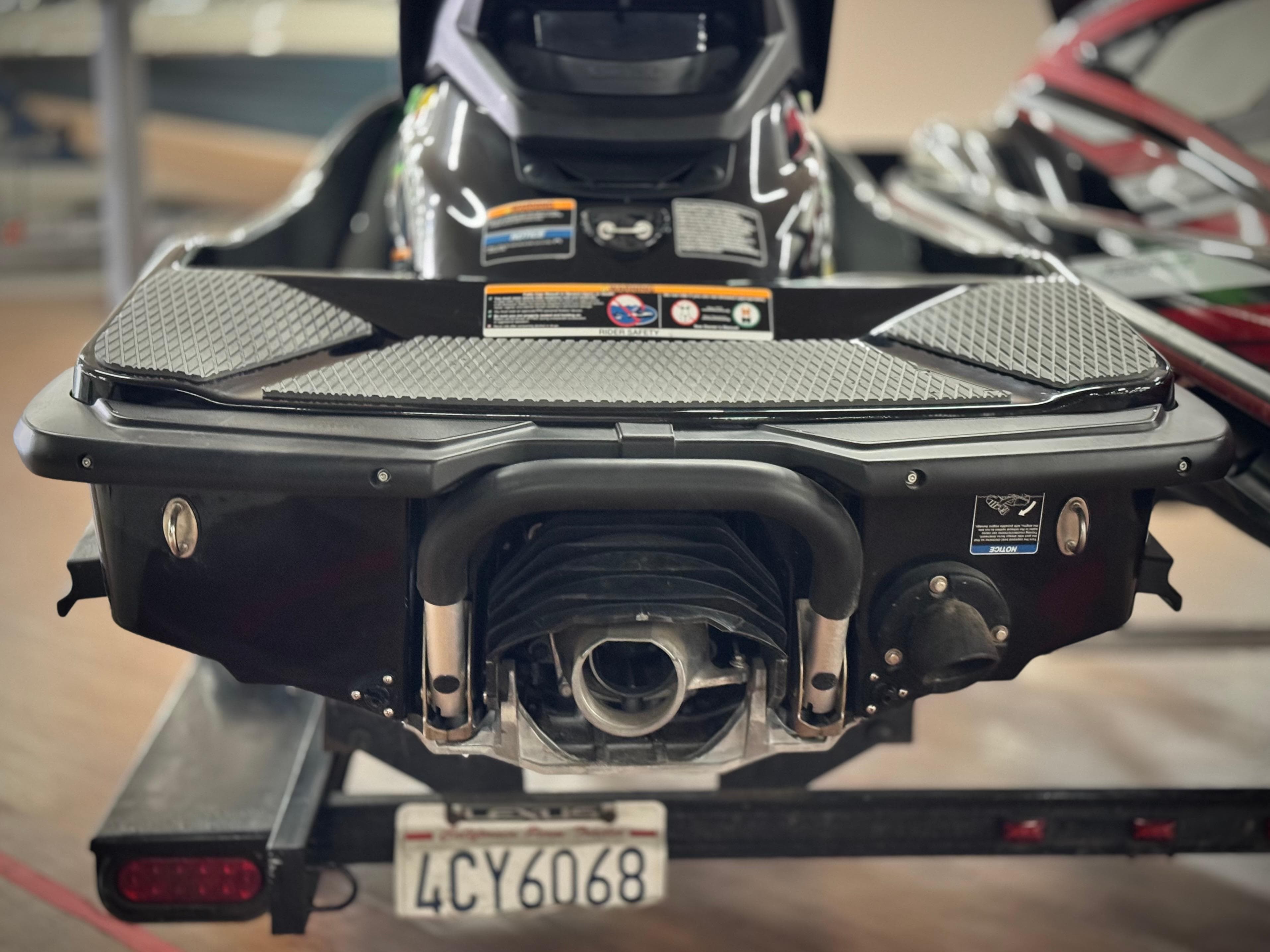 2023 Kawasaki Jetski STX 160X rear view on trailer, showcasing engine and design details.