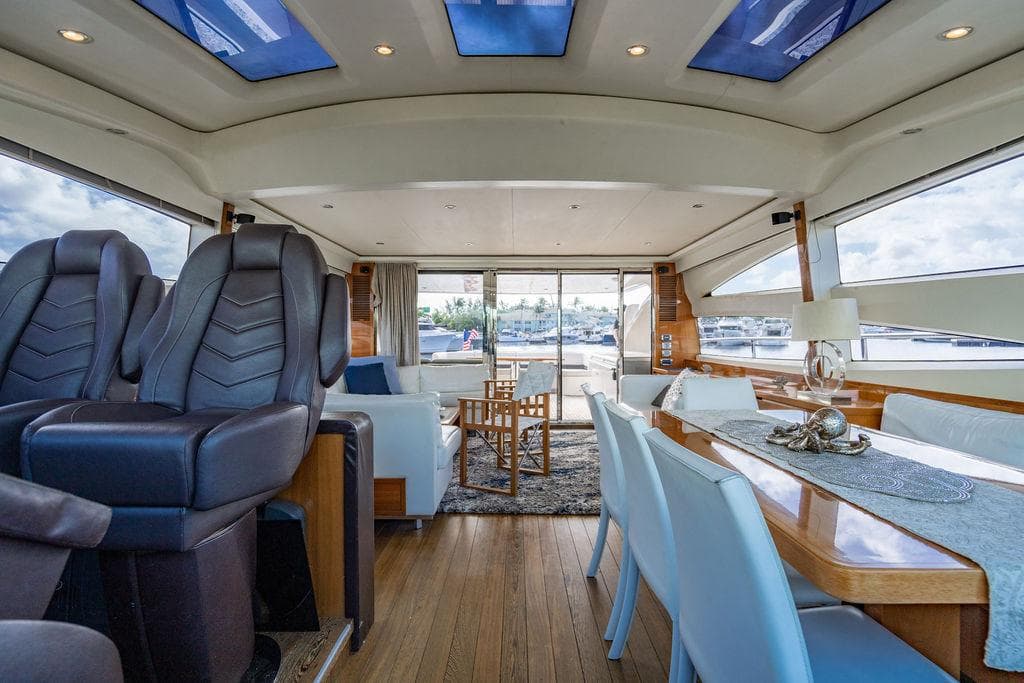 Luxurious interior of 2010 Princess V78 yacht with elegant seating and dining area.